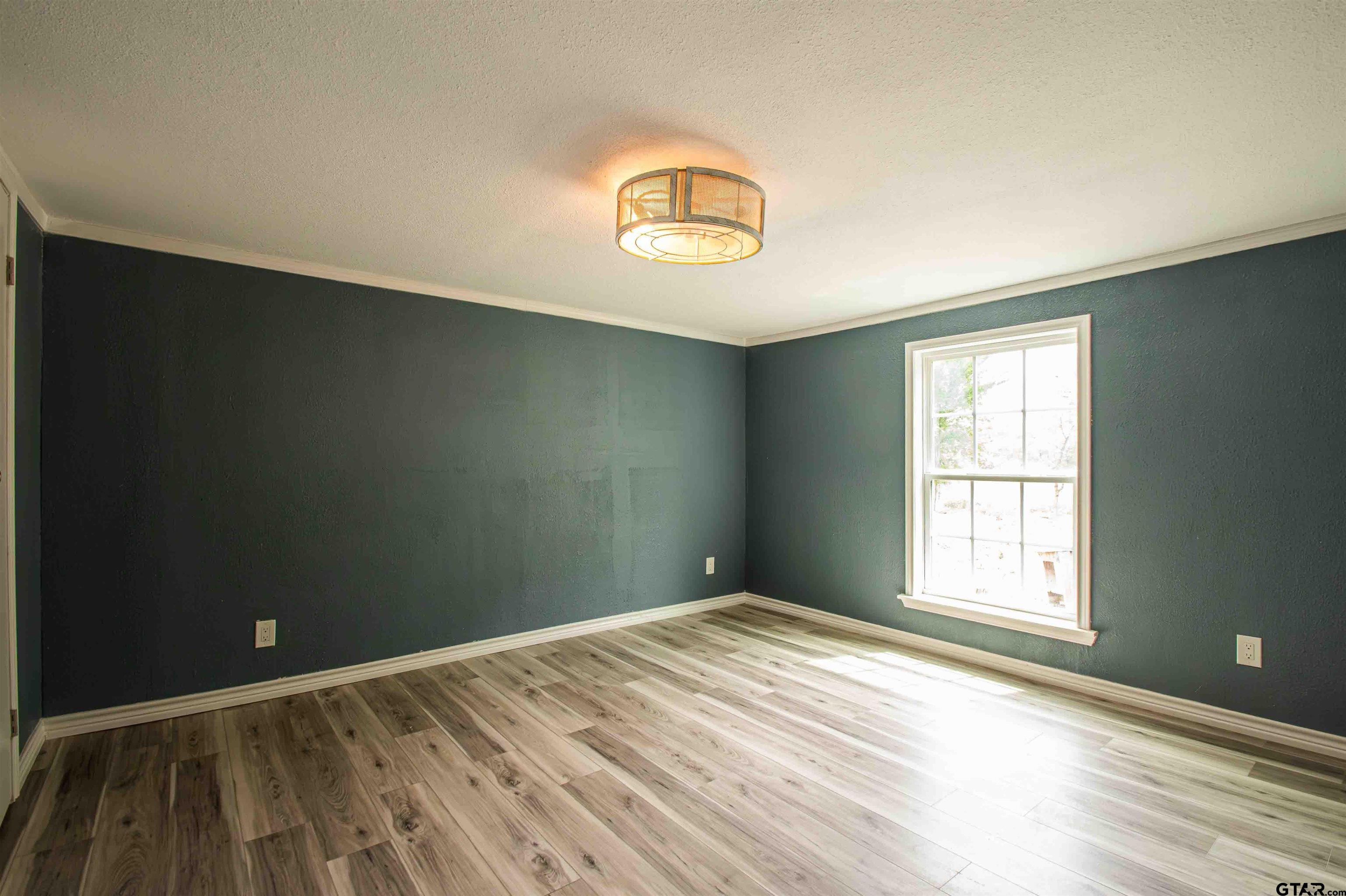 161 Clearview Circle Murchison, TX 75778 - Photo 28 of 47 a view of a room with wooden floor and window