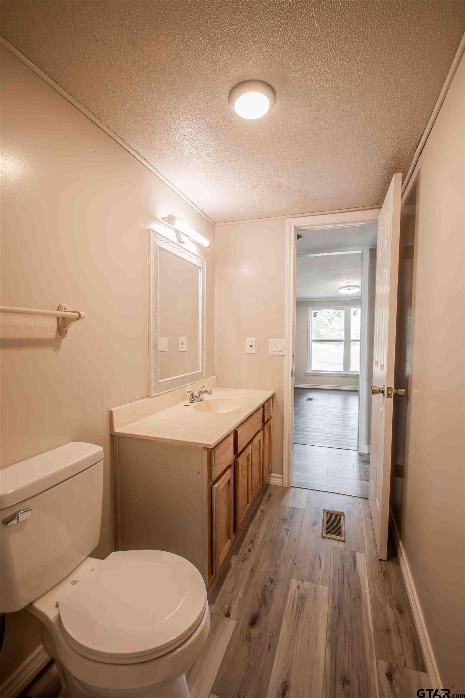 161 Clearview Circle Murchison, TX 75778 - Photo 29 of 47 a bathroom with a sink a toilet and shower