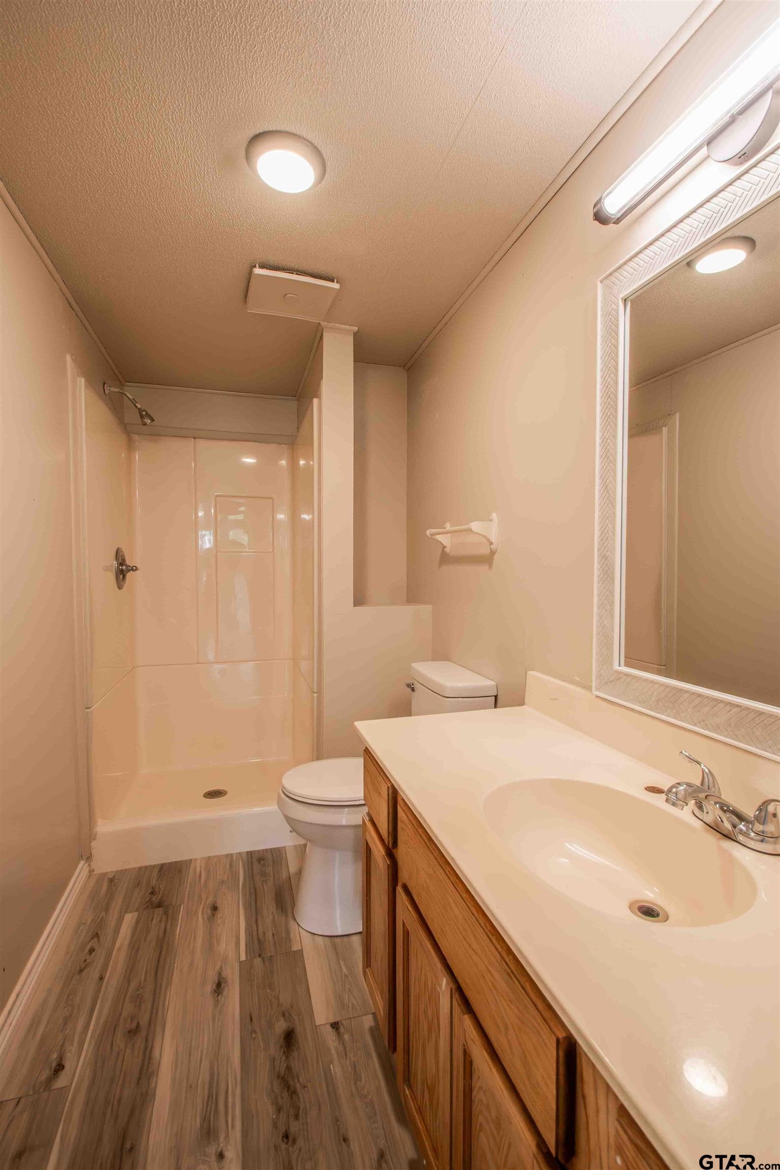 161 Clearview Circle Murchison, TX 75778 - Photo 30 of 47 a bathroom with a sink a toilet and shower