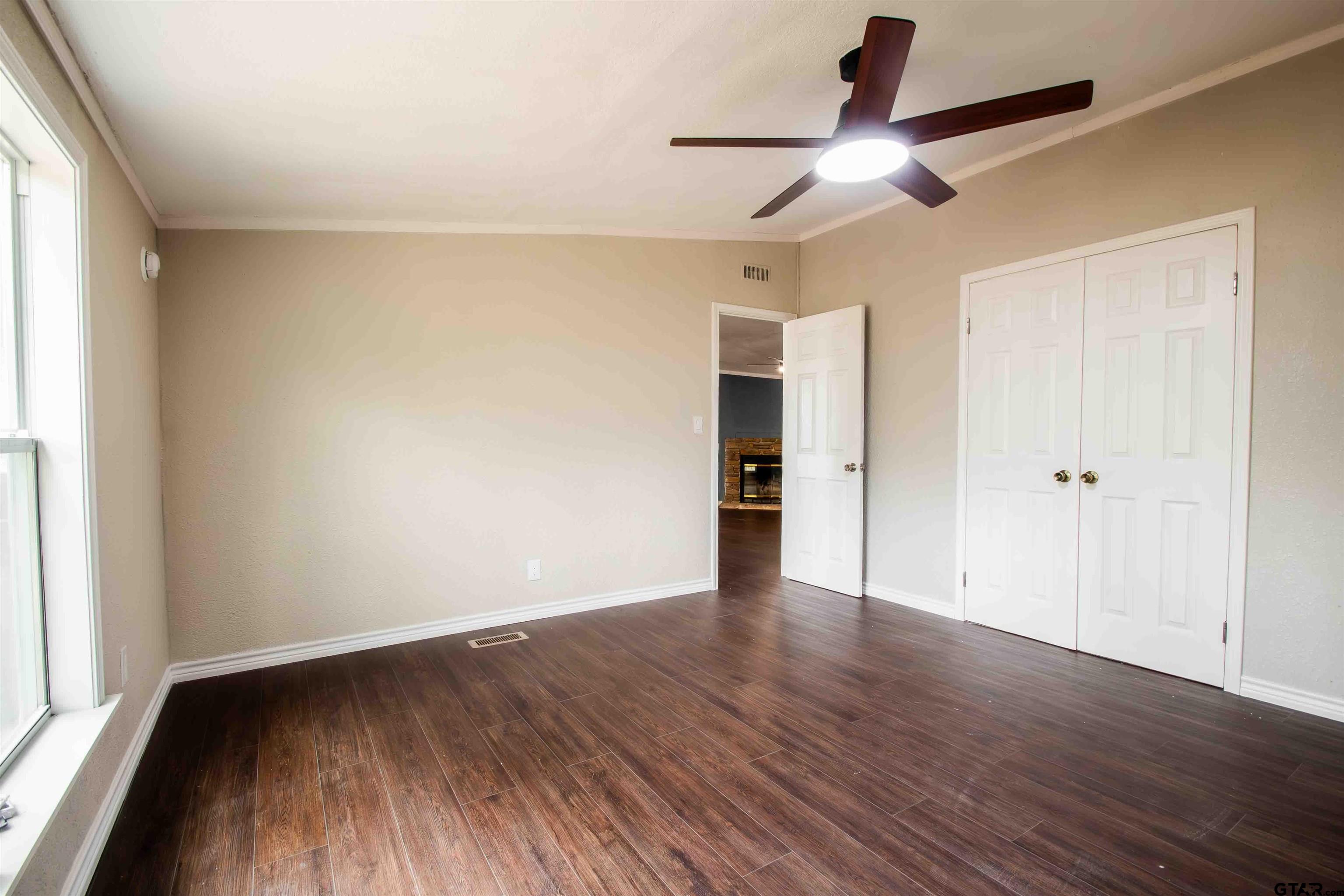 161 Clearview Circle Murchison, TX 75778 - Photo 35 of 47 wooden floor in an empty room with a window