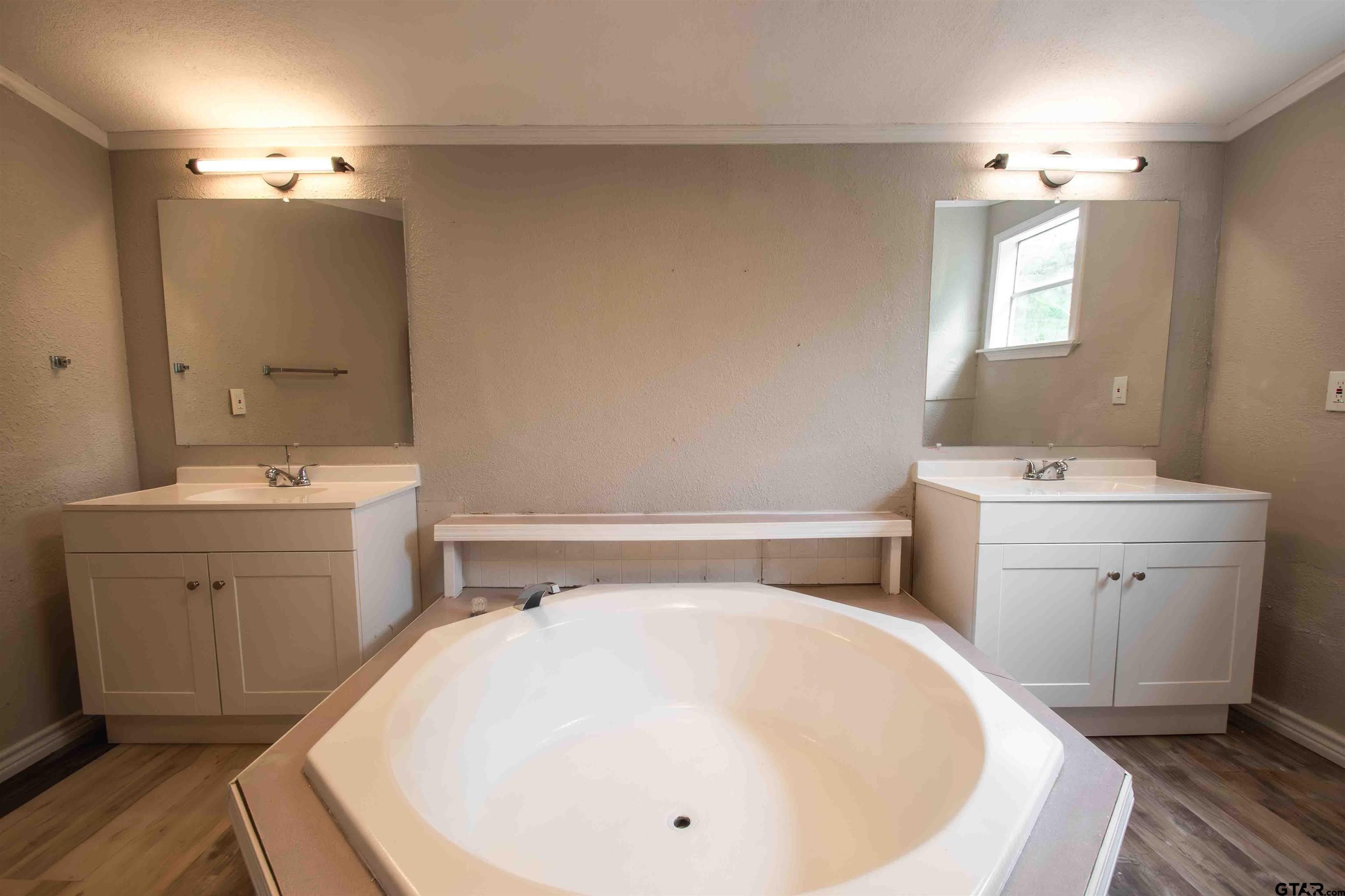 161 Clearview Circle Murchison, TX 75778 - Photo 38 of 47 a bathroom with a sink and a mirror