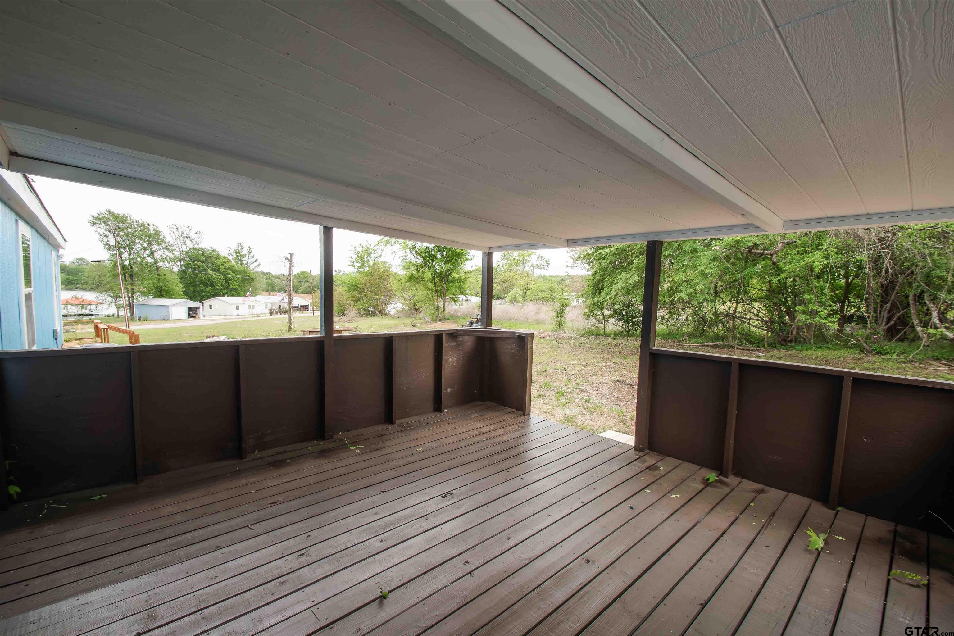 161 Clearview Circle Murchison, TX 75778 - Photo 7 of 47 a view of a deck with wooden floor and wooden floor