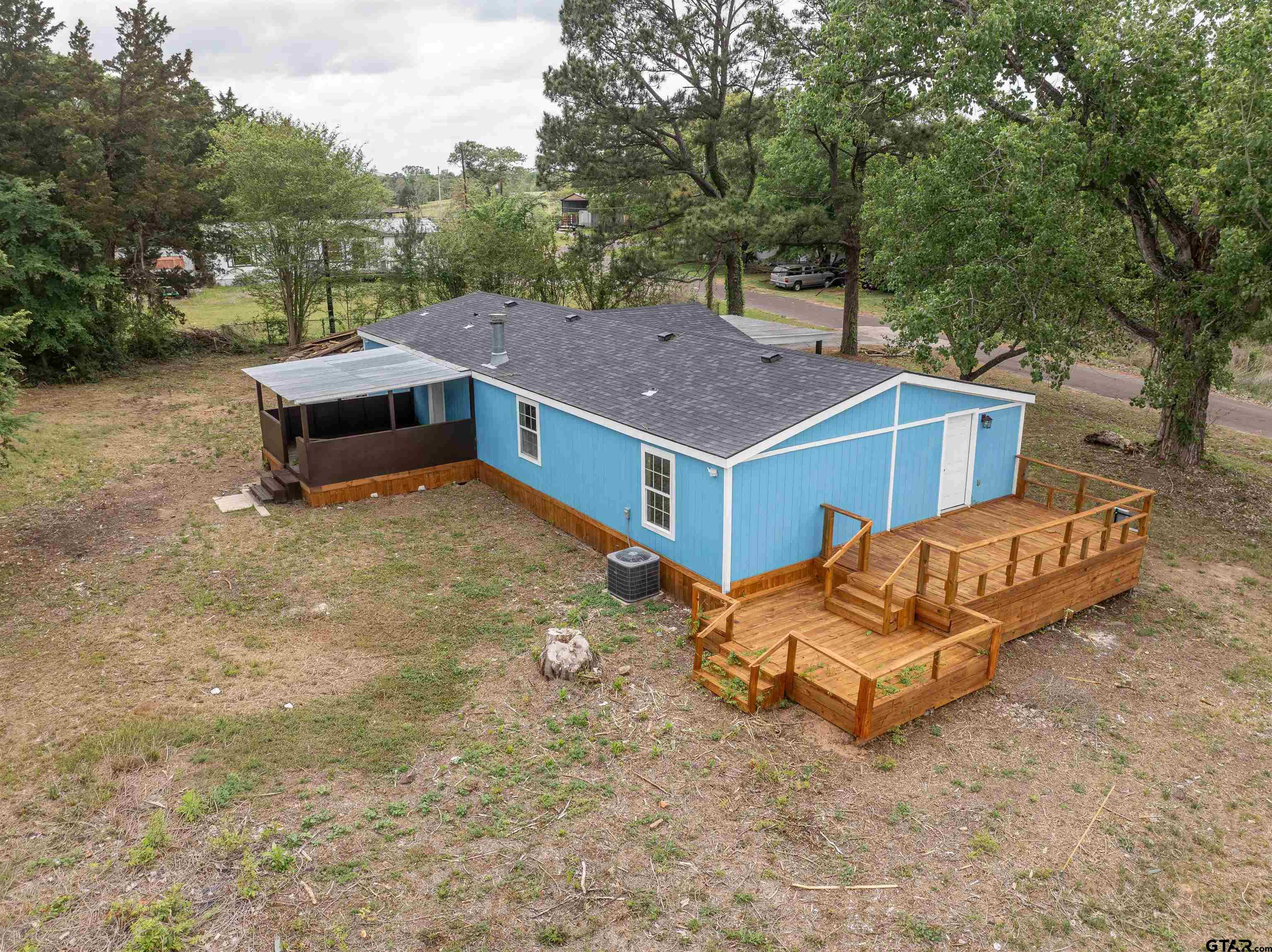 161 Clearview Circle Murchison, TX 75778 - Photo 9 of 47 a view of a house with a yard and sitting area