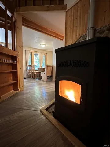a living room with fireplace furniture and a flat screen tv