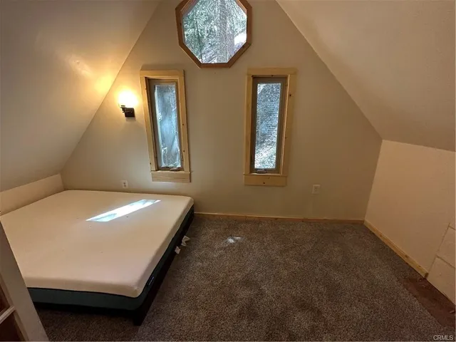 a room with windows and a chandelier