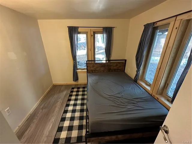a view of bedroom and wooden floor