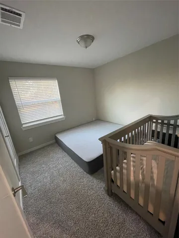 a view of a room with furniture and window