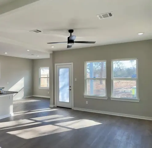 a view of an empty room with a window