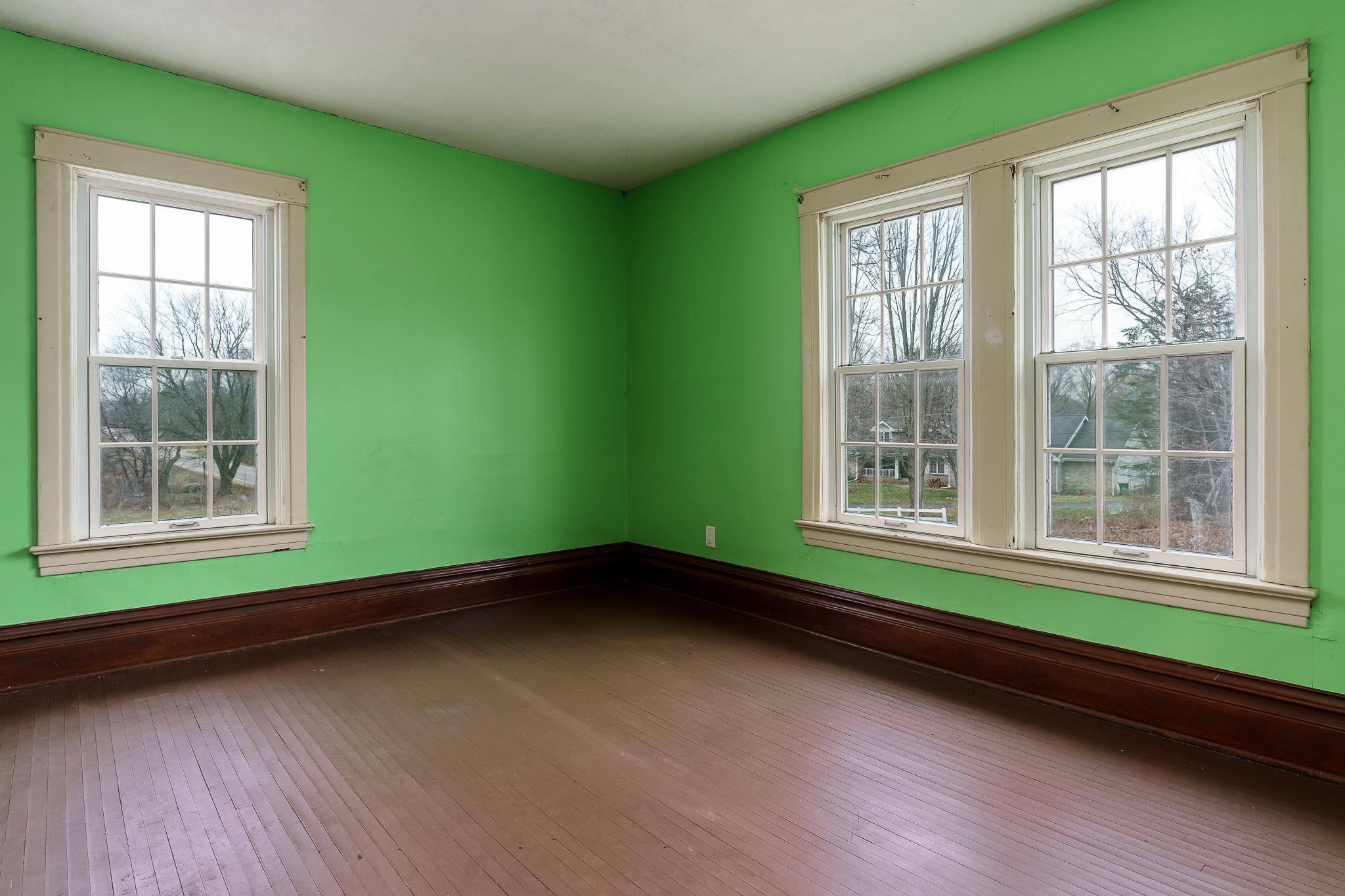 2826 Orth Road Belvidere, IL 61008 - Photo 35 of 43 a view of an empty room with a window and wooden floor