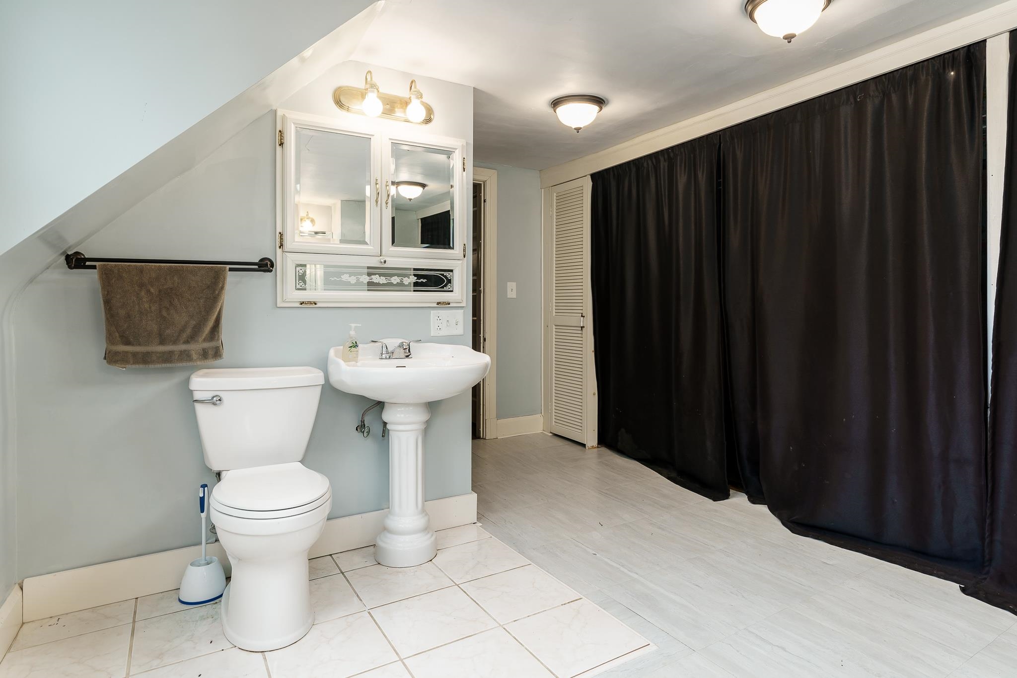 2826 Orth Road Belvidere, IL 61008 - Photo 43 of 43 a bathroom with a sink toilet mirror and vanity