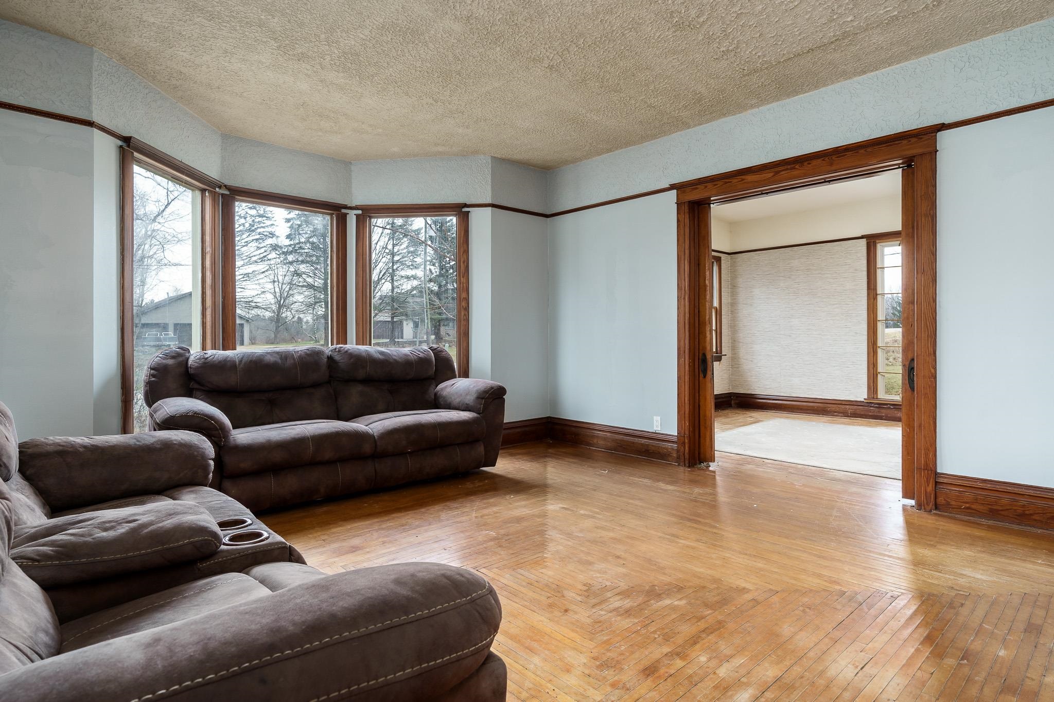 2826 Orth Road Belvidere, IL 61008 - Photo 9 of 43 a living room with furniture and a large window