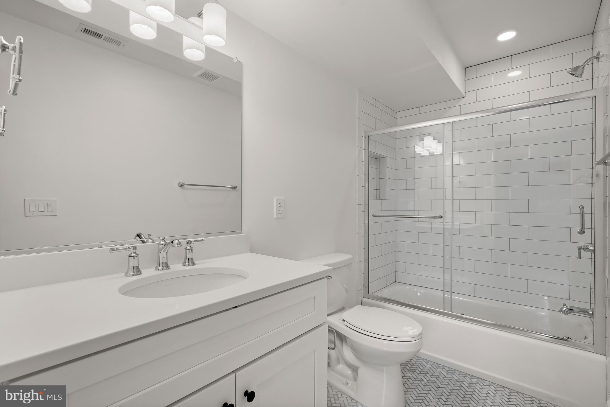 3719 R Street Northwest Washington, DC 20007 - Photo 31 of 44 a bathroom with a sink a toilet and shower