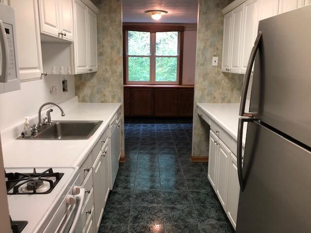 1705 Summit Pointe Scranton, PA 18508 - Photo 3 of 13 a kitchen with sink a refrigerator and a stove