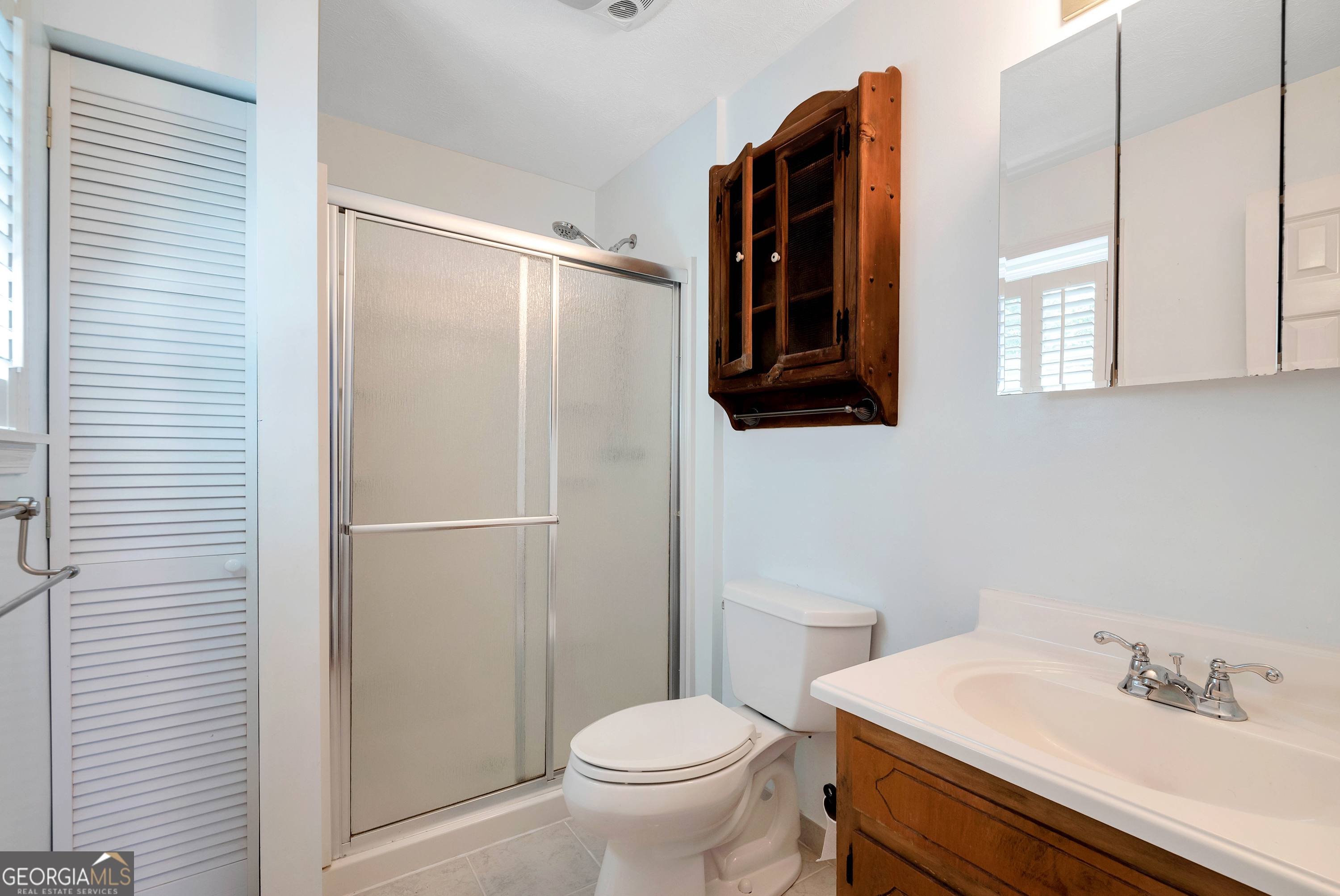 303 Jennys Cove Road Cleveland, GA 30528 - Photo 16 of 60 a bathroom with a sink toilet and shower