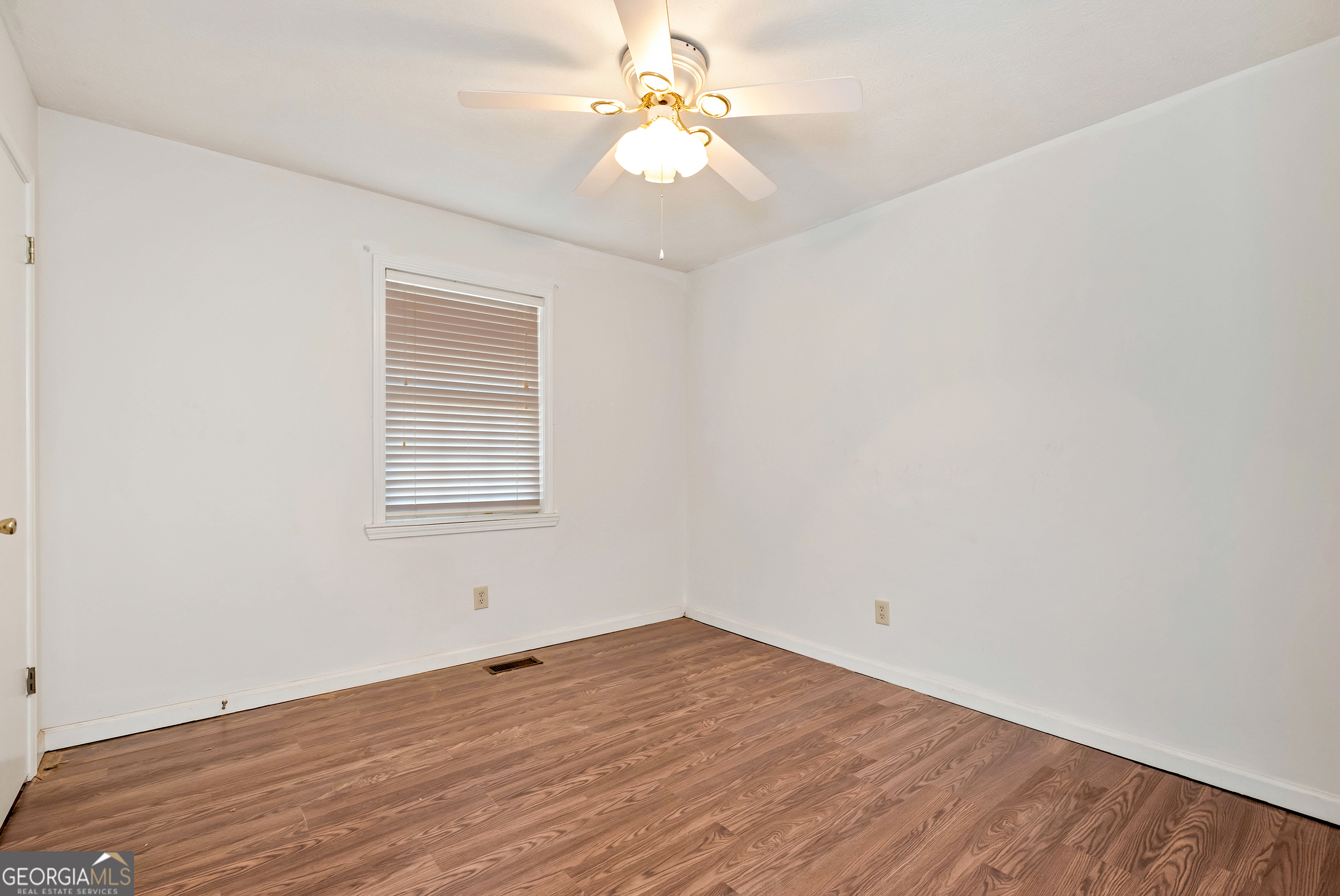 303 Jennys Cove Road Cleveland, GA 30528 - Photo 17 of 60 wooden floor in an empty room with a window