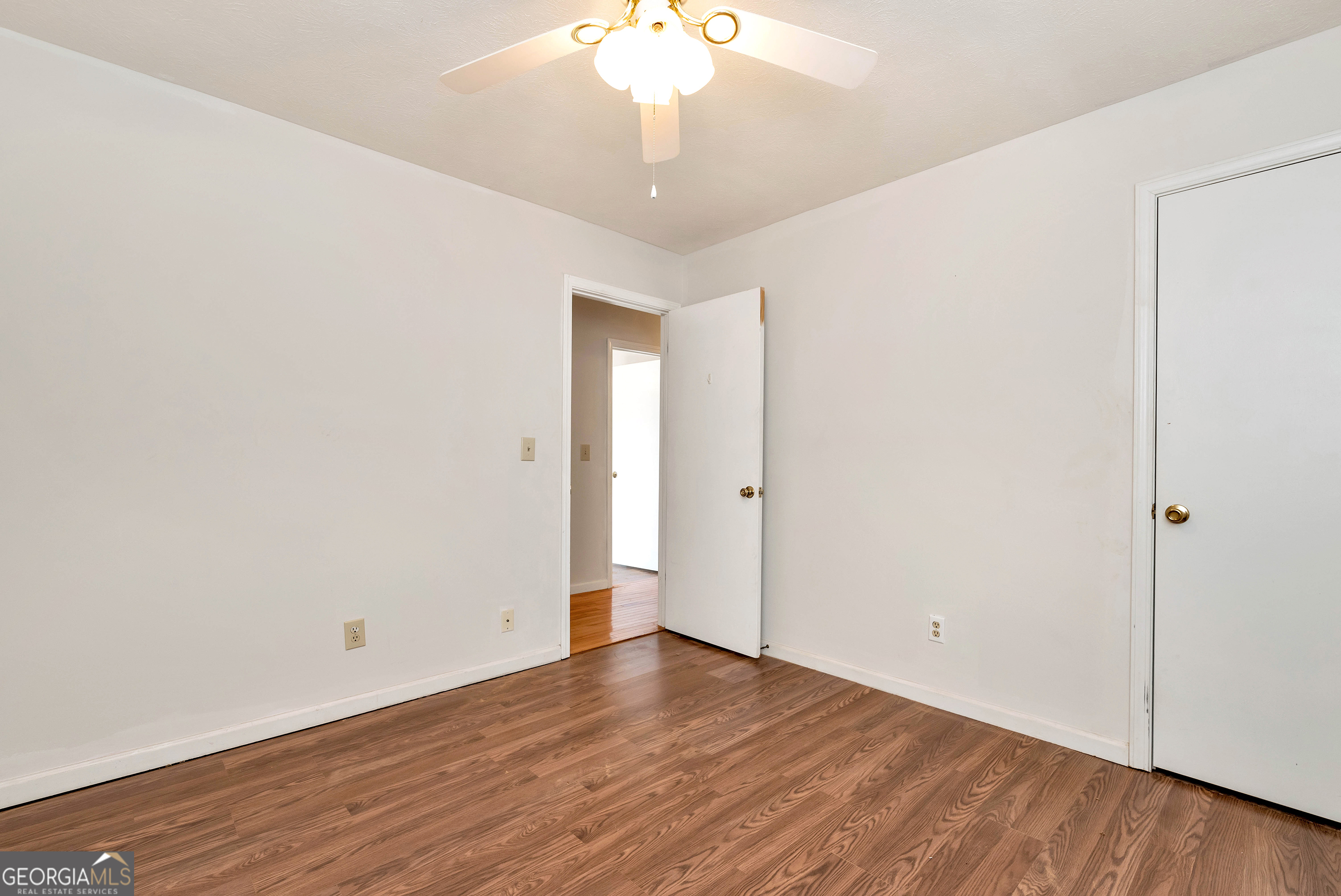 303 Jennys Cove Road Cleveland, GA 30528 - Photo 18 of 60 a view of an empty room with wooden floor