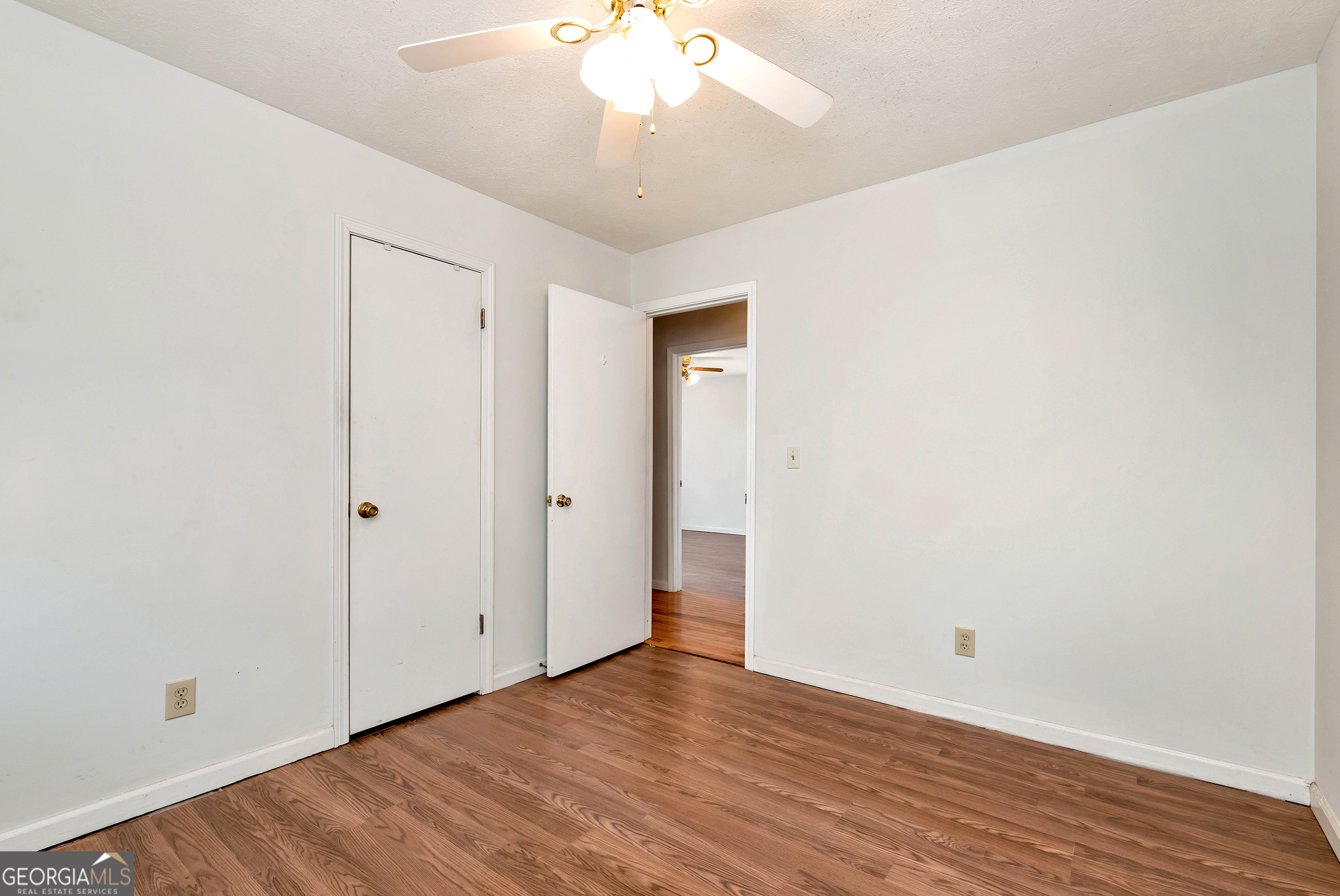 303 Jennys Cove Road Cleveland, GA 30528 - Photo 20 of 60 a view of an empty room with wooden floor