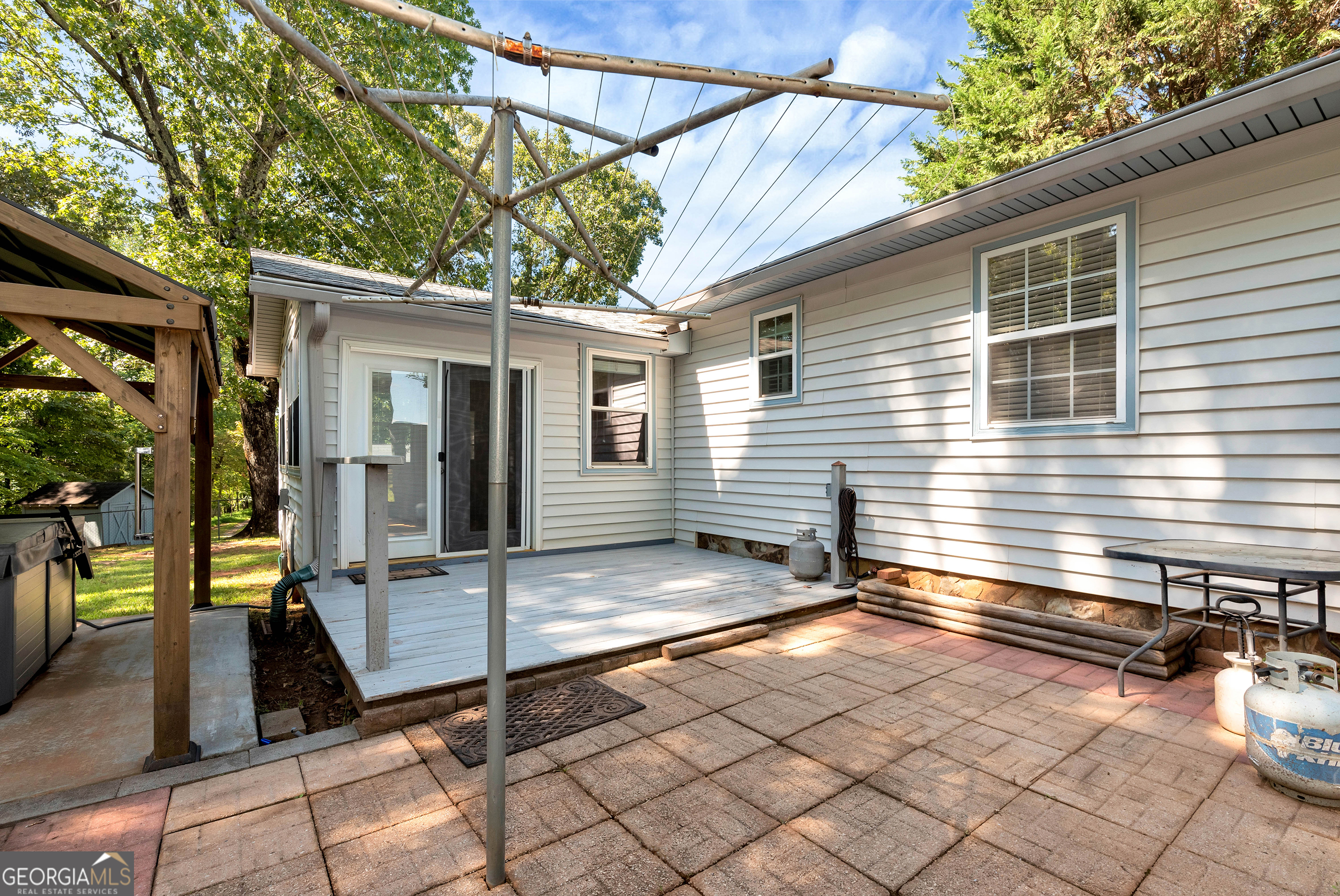 303 Jennys Cove Road Cleveland, GA 30528 - Photo 26 of 60 a view of a house with backyard and sitting area