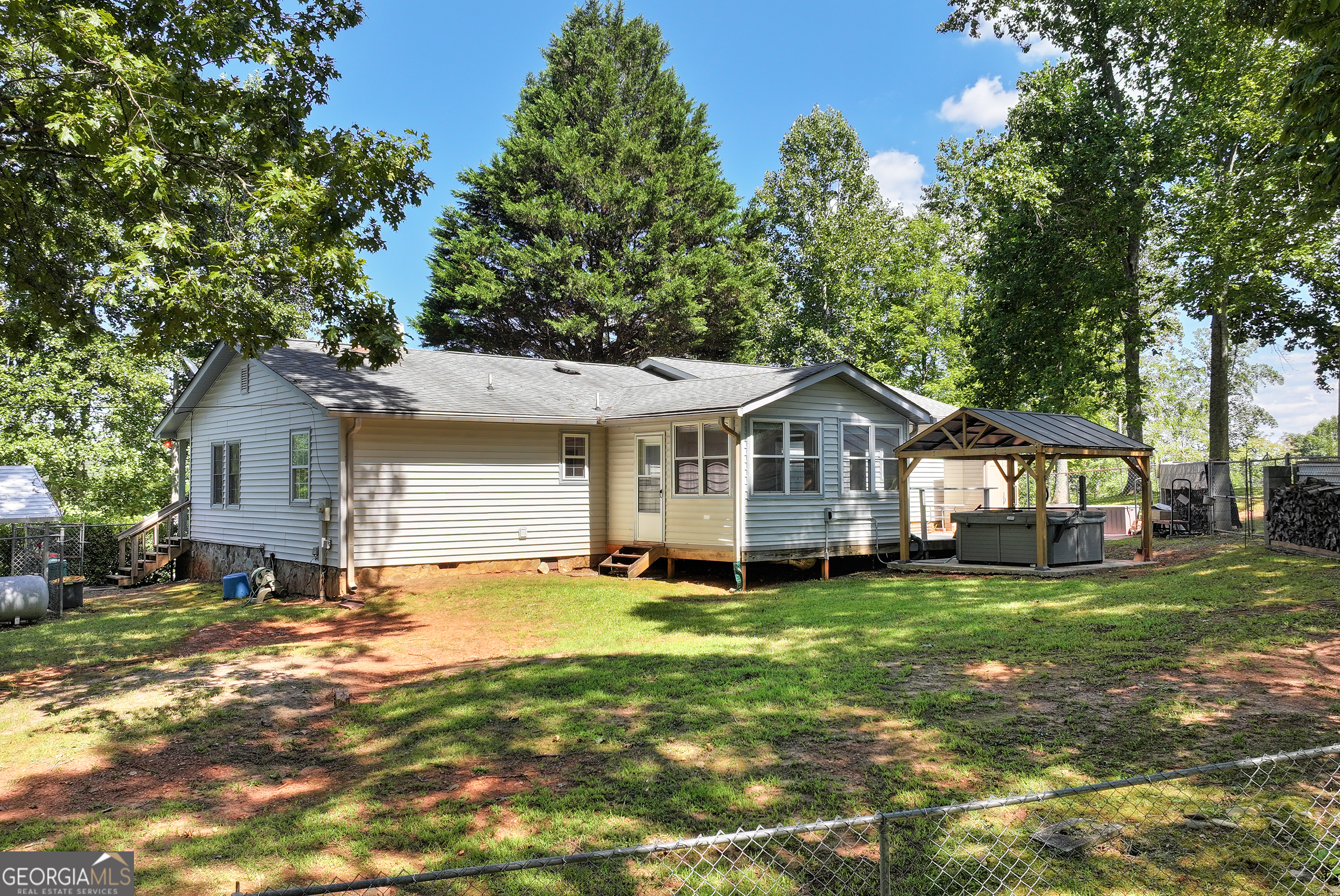 303 Jennys Cove Road Cleveland, GA 30528 - Photo 29 of 60 a front view of a house with a yard
