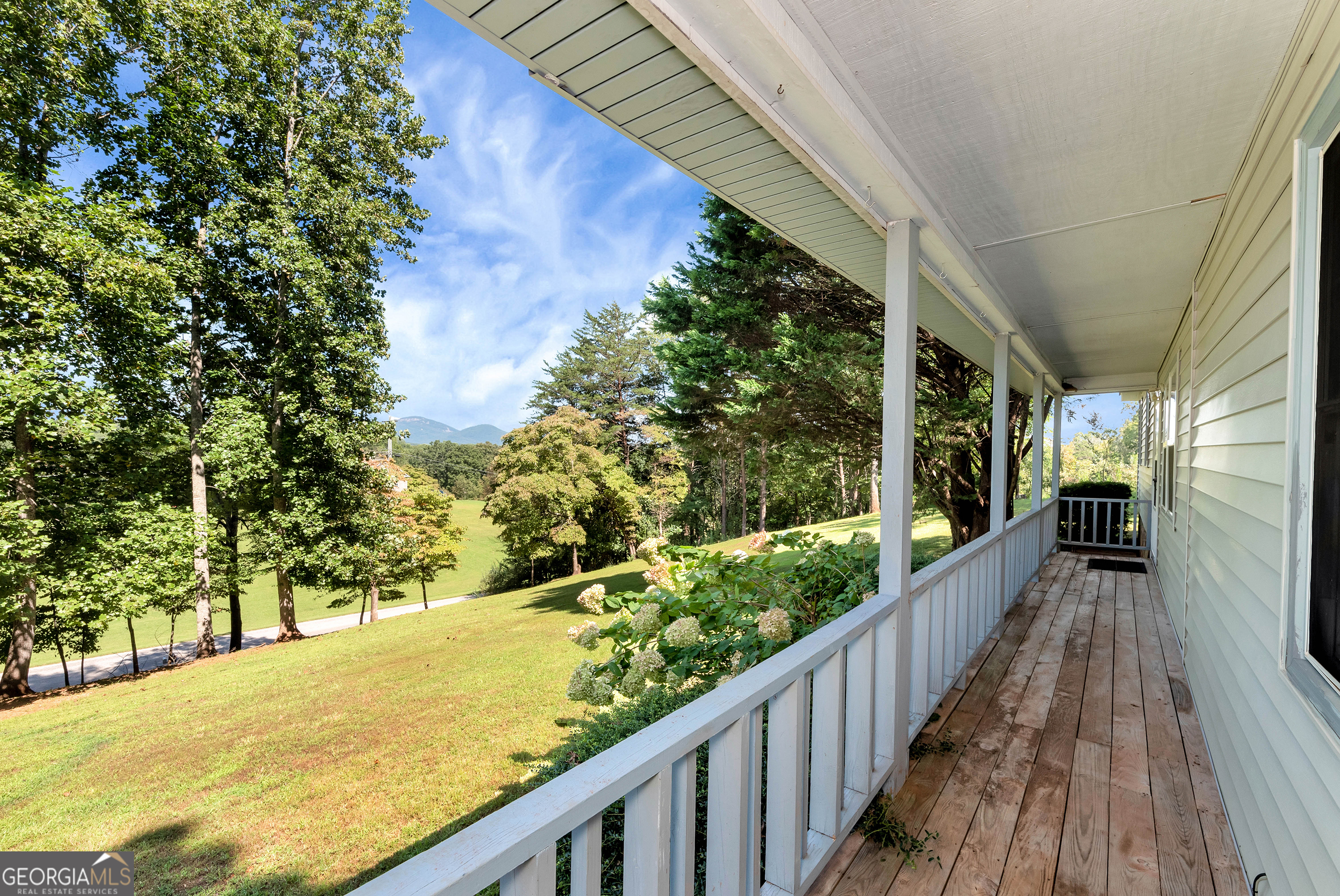 303 Jennys Cove Road Cleveland, GA 30528 - Photo 30 of 60 a view of a balcony with wooden floor