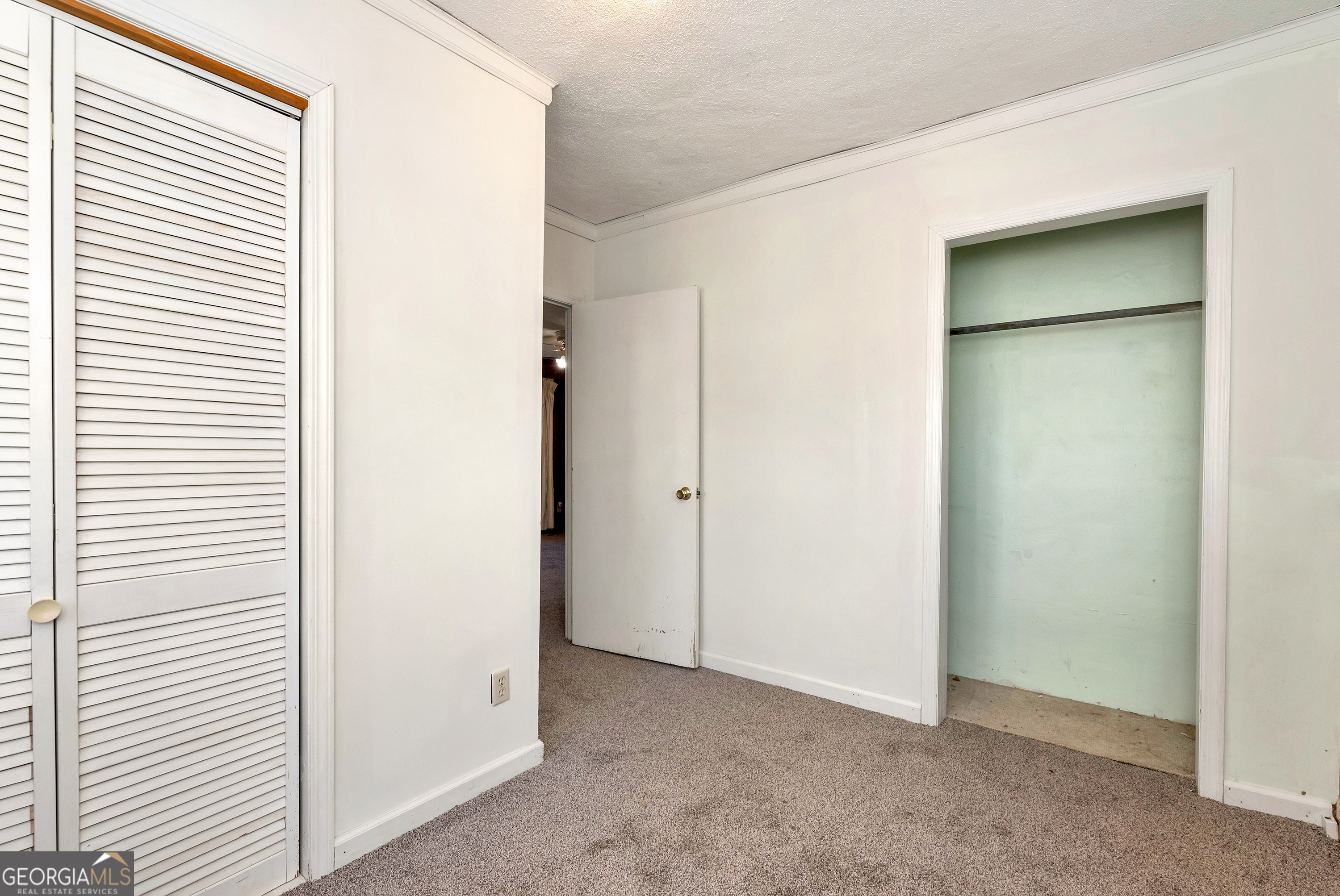 303 Jennys Cove Road Cleveland, GA 30528 - Photo 42 of 60 a view of an empty room with closet and a window