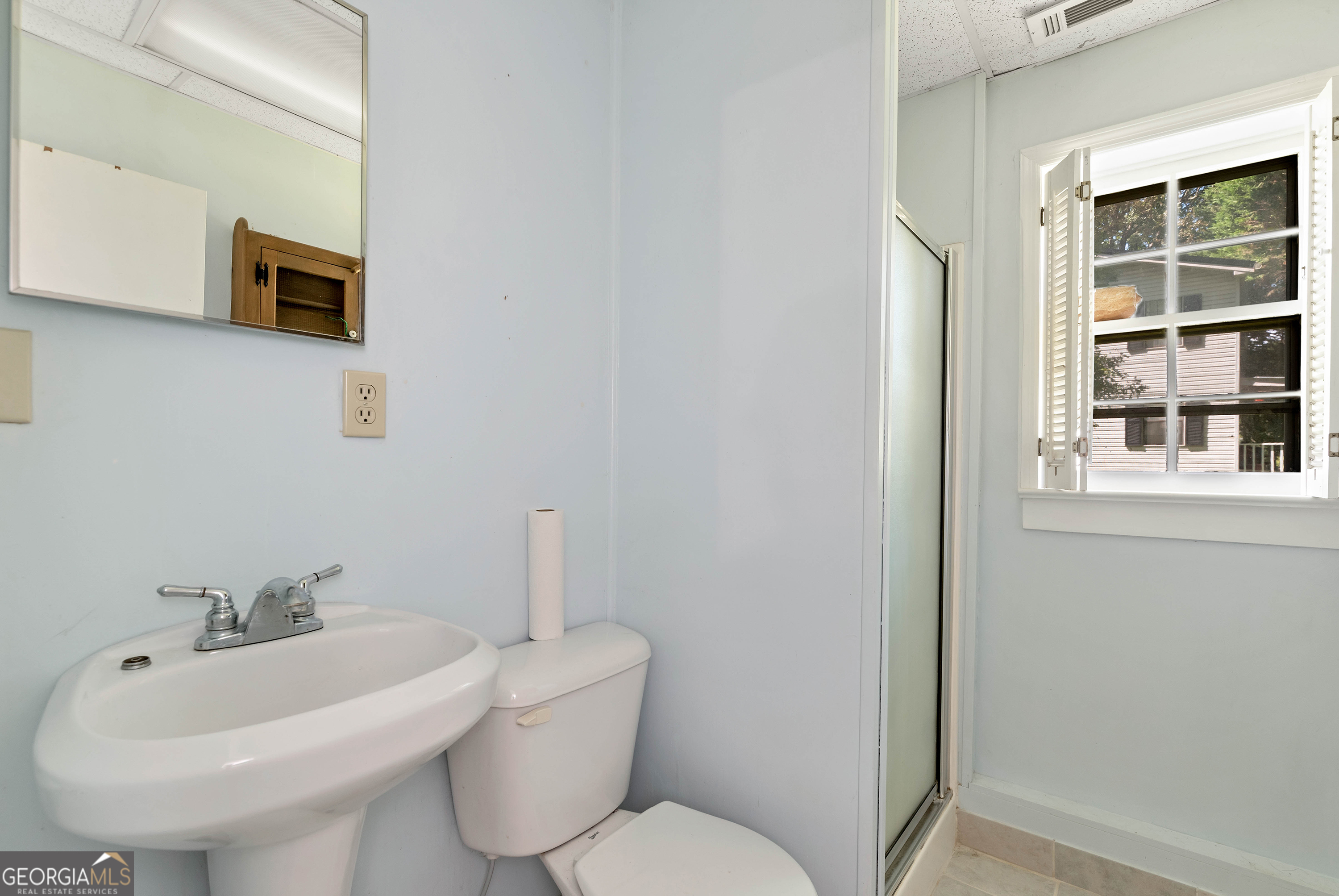 303 Jennys Cove Road Cleveland, GA 30528 - Photo 45 of 60 a bathroom with a sink a toilet and mirror