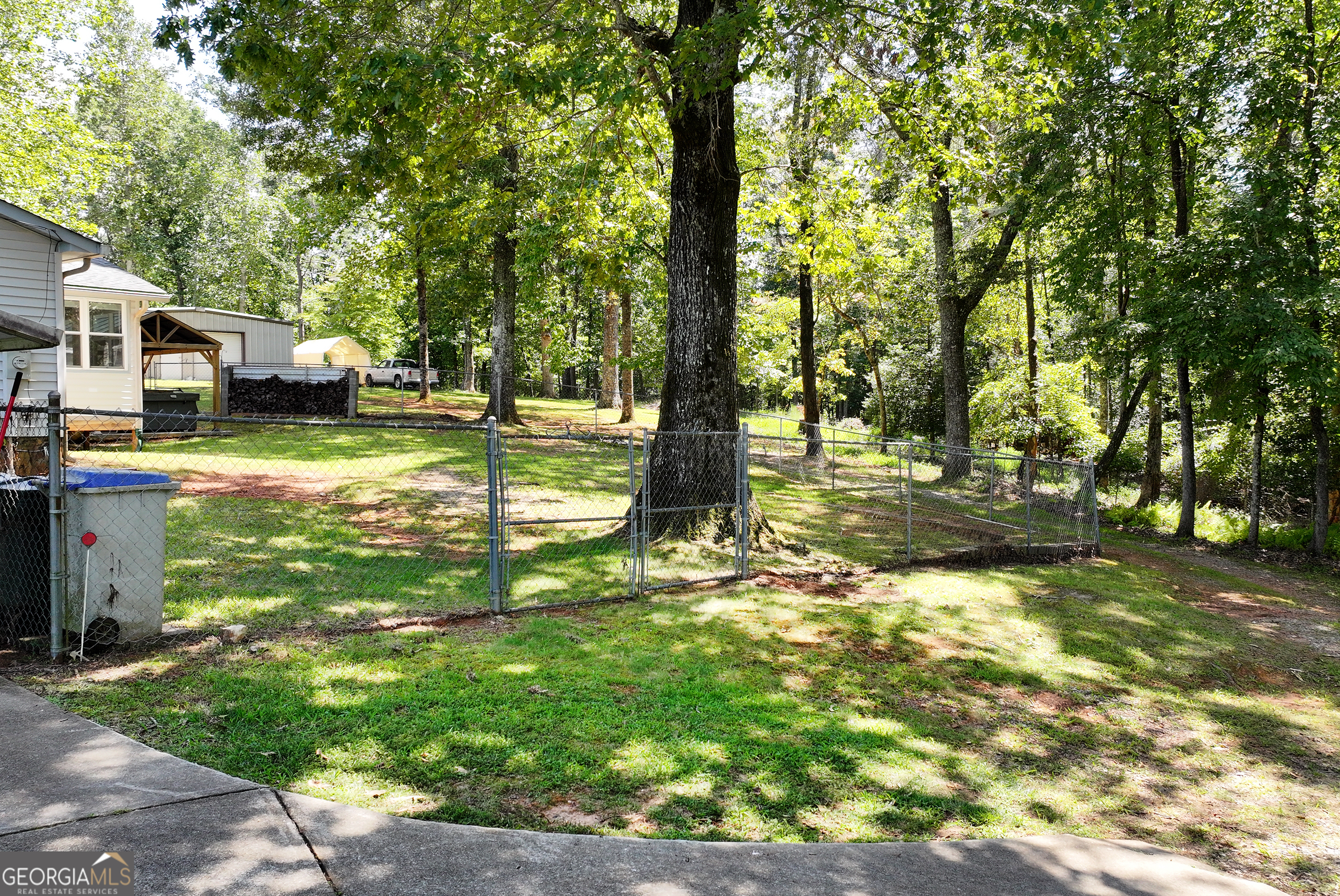 303 Jennys Cove Road Cleveland, GA 30528 - Photo 47 of 60 a view of a yard with plants and trees