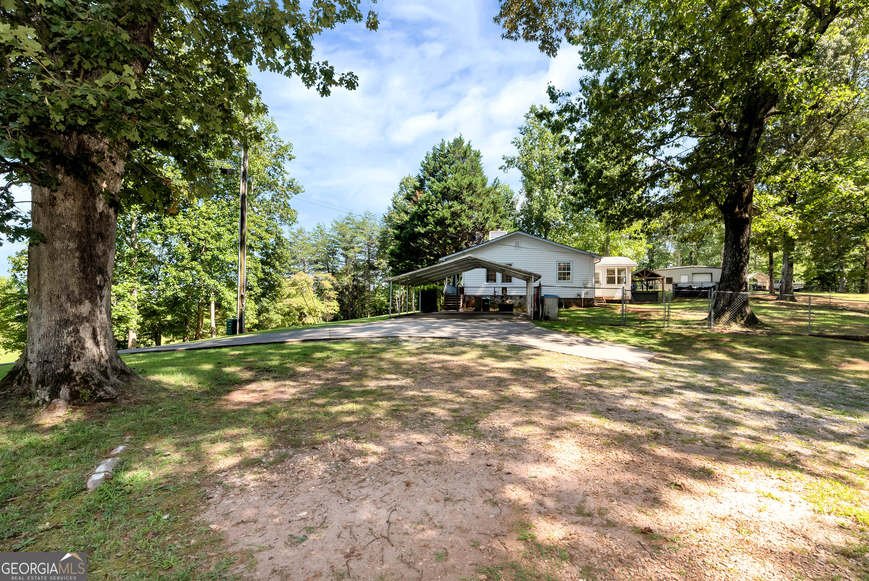 303 Jennys Cove Road Cleveland, GA 30528 - Photo 48 of 60 a front view of a house with a yard