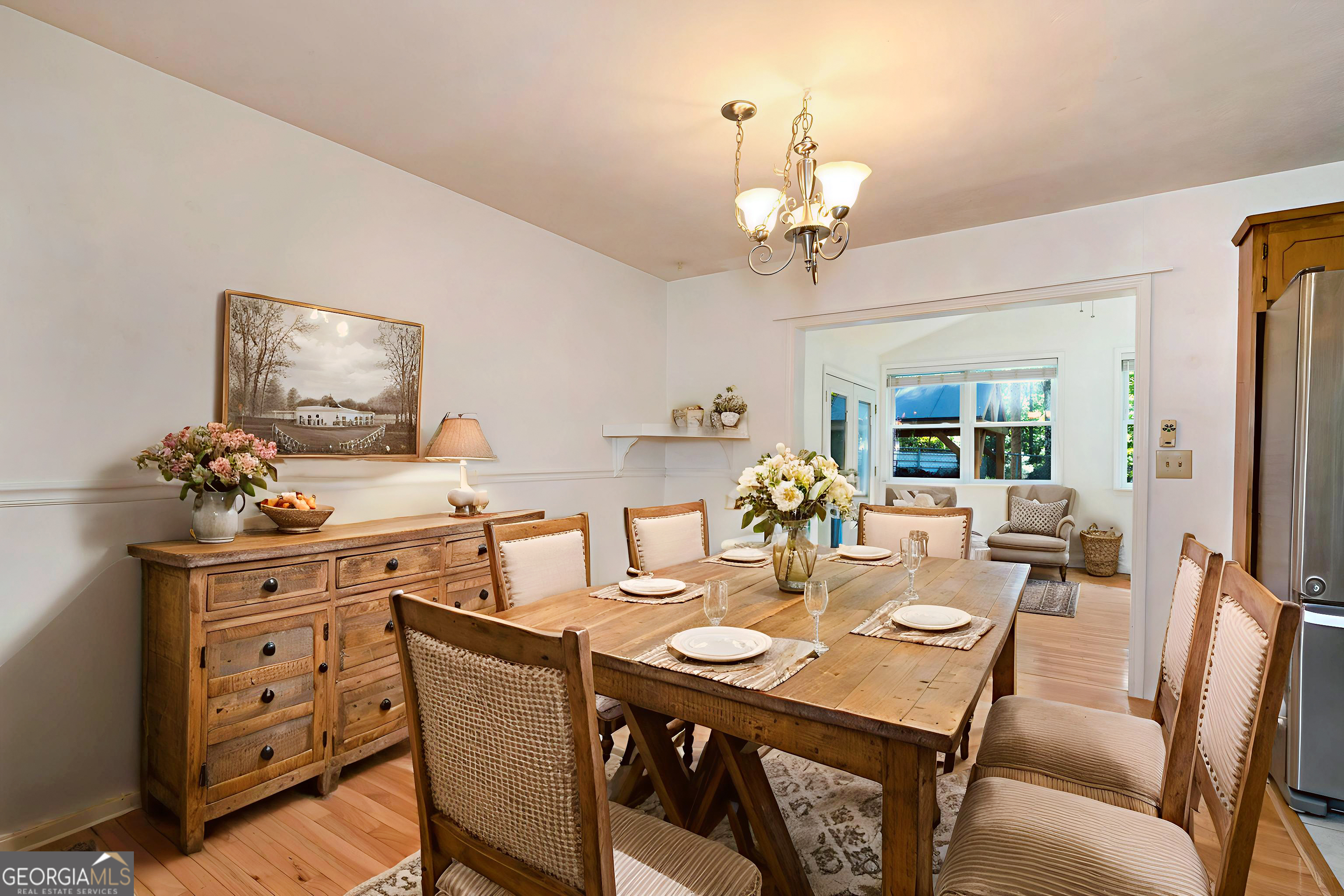 303 Jennys Cove Road Cleveland, GA 30528 - Photo 7 of 60 a view of a dining room with furniture window and wooden floor