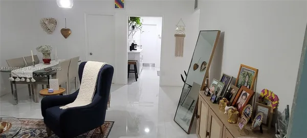 a view of a living room with furniture