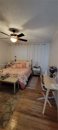 a bedroom with a bed and a table in it