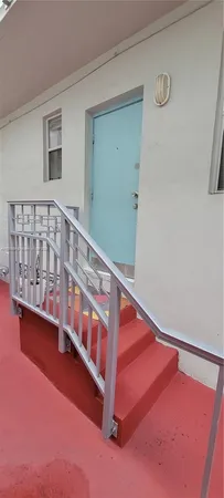 a view of staircase with white walls