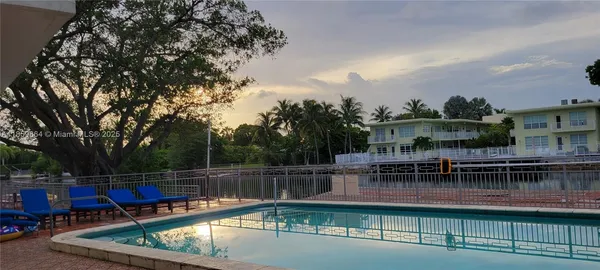 a view of a swimming pool with a lake view