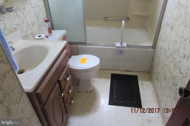 208 German Hill Road Baltimore, MD 21222 - Photo 14 of 24 a bathroom with a sink and a toilet