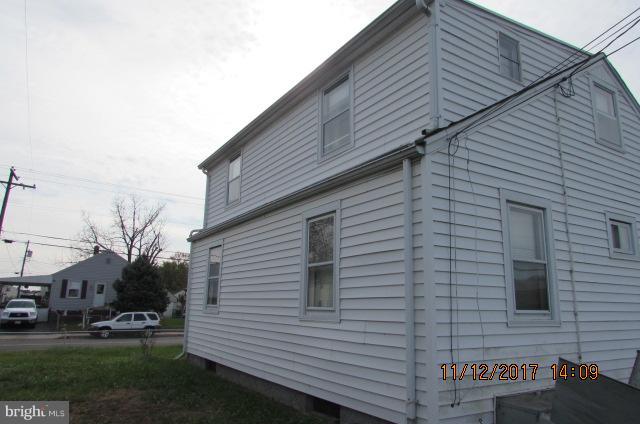 208 German Hill Road Baltimore, MD 21222 - Photo 4 of 24 a view of a house with a yard and garage