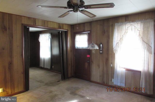208 German Hill Road Baltimore, MD 21222 - Photo 7 of 24 wooden floor in an empty room with a window