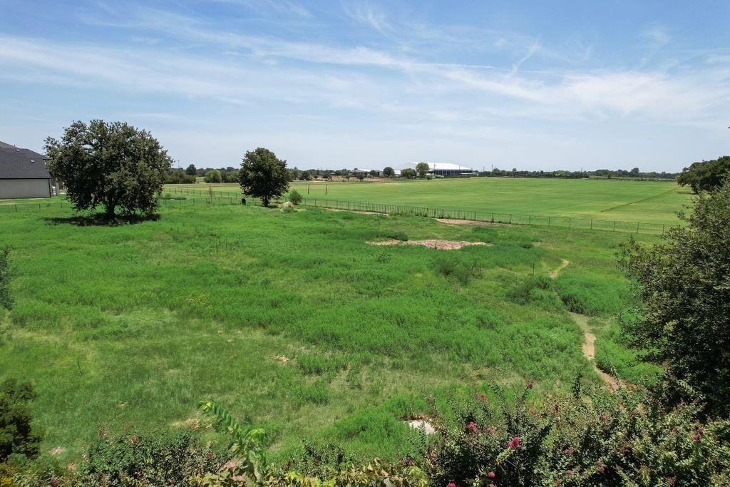 521 Martingale Trail Oak Point, TX 75068 - Photo 23 of 36 a backyard of a house with lots of green space and fog