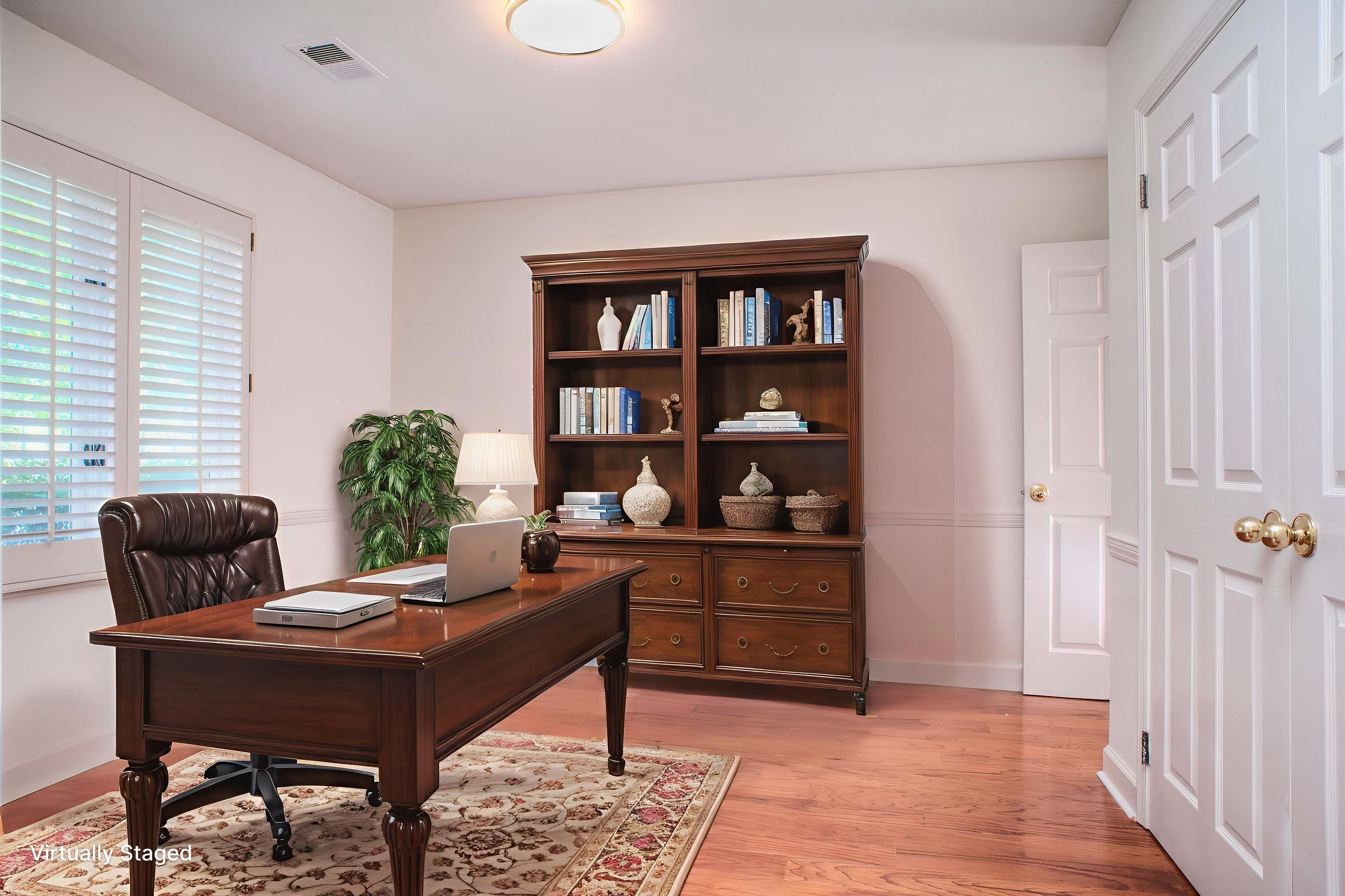 8225 Walnut Grove Road Memphis, TN 38018 - Photo 24 of 29 a living room with furniture and a potted plant