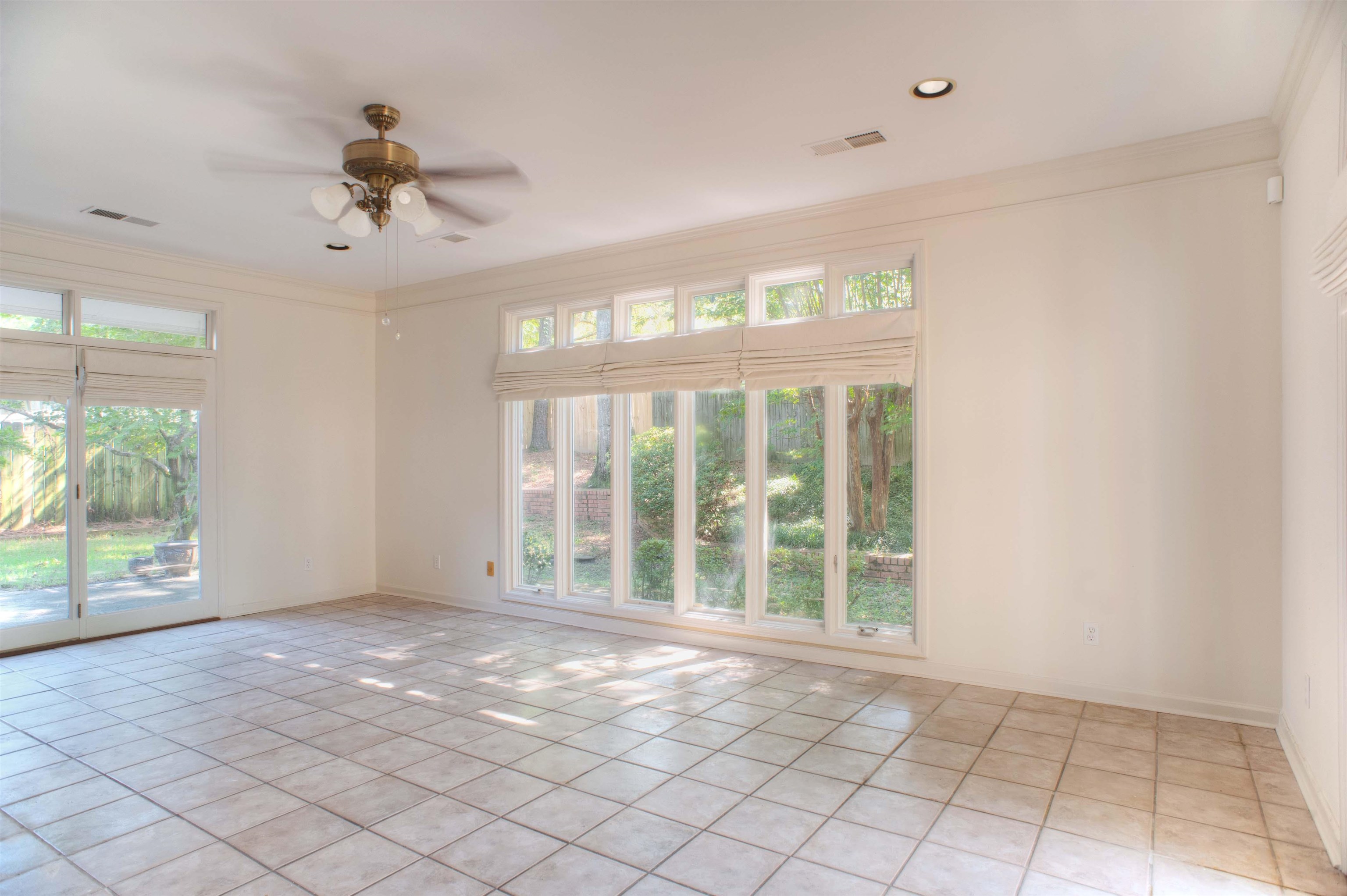 8225 Walnut Grove Road Memphis, TN 38018 - Photo 8 of 29 a view of an empty room with a window