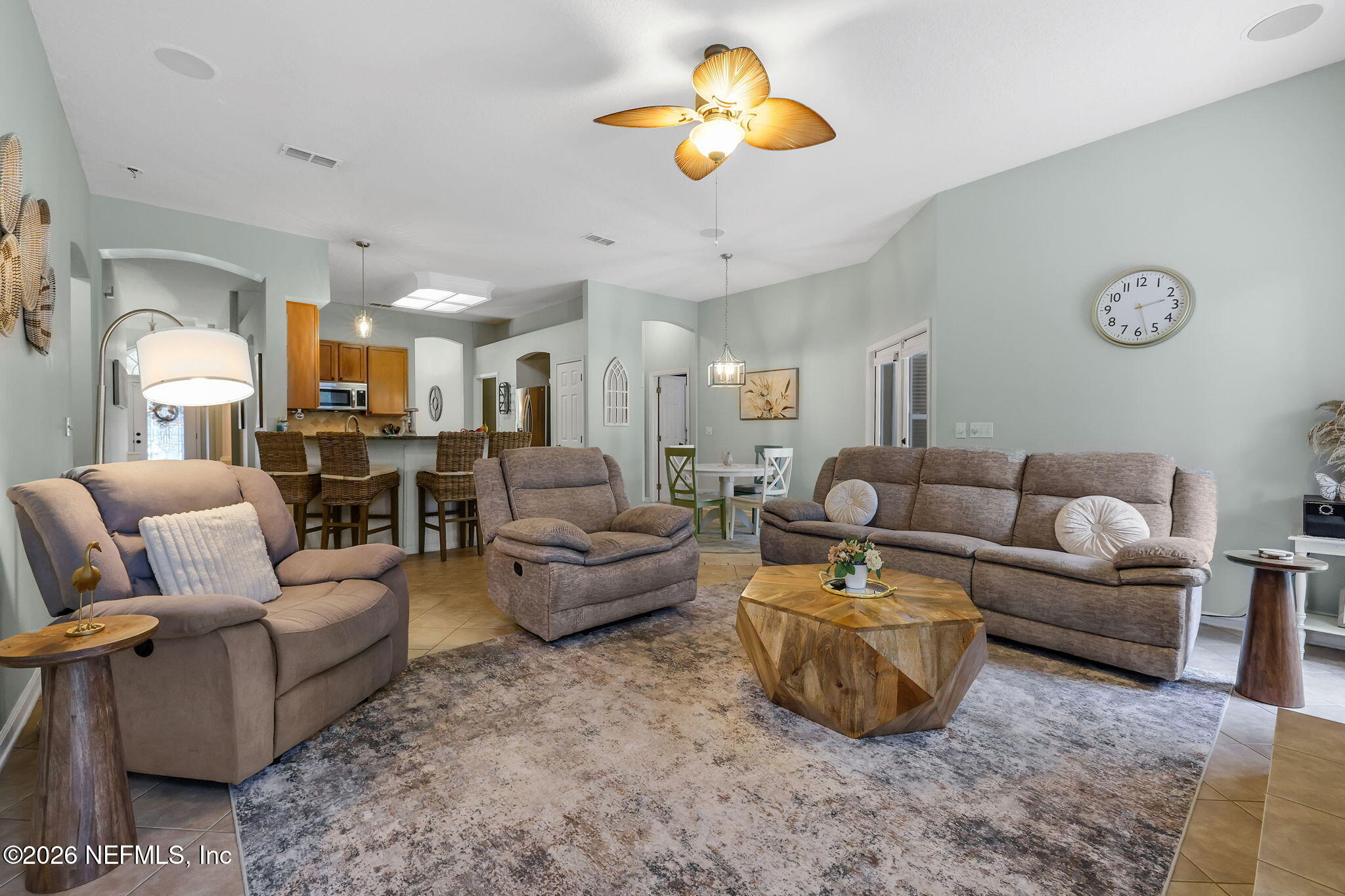 4320 Rye Court St. Johns, FL 32259 - Photo 13 of 60 a living room with furniture kitchen view and a chandelier