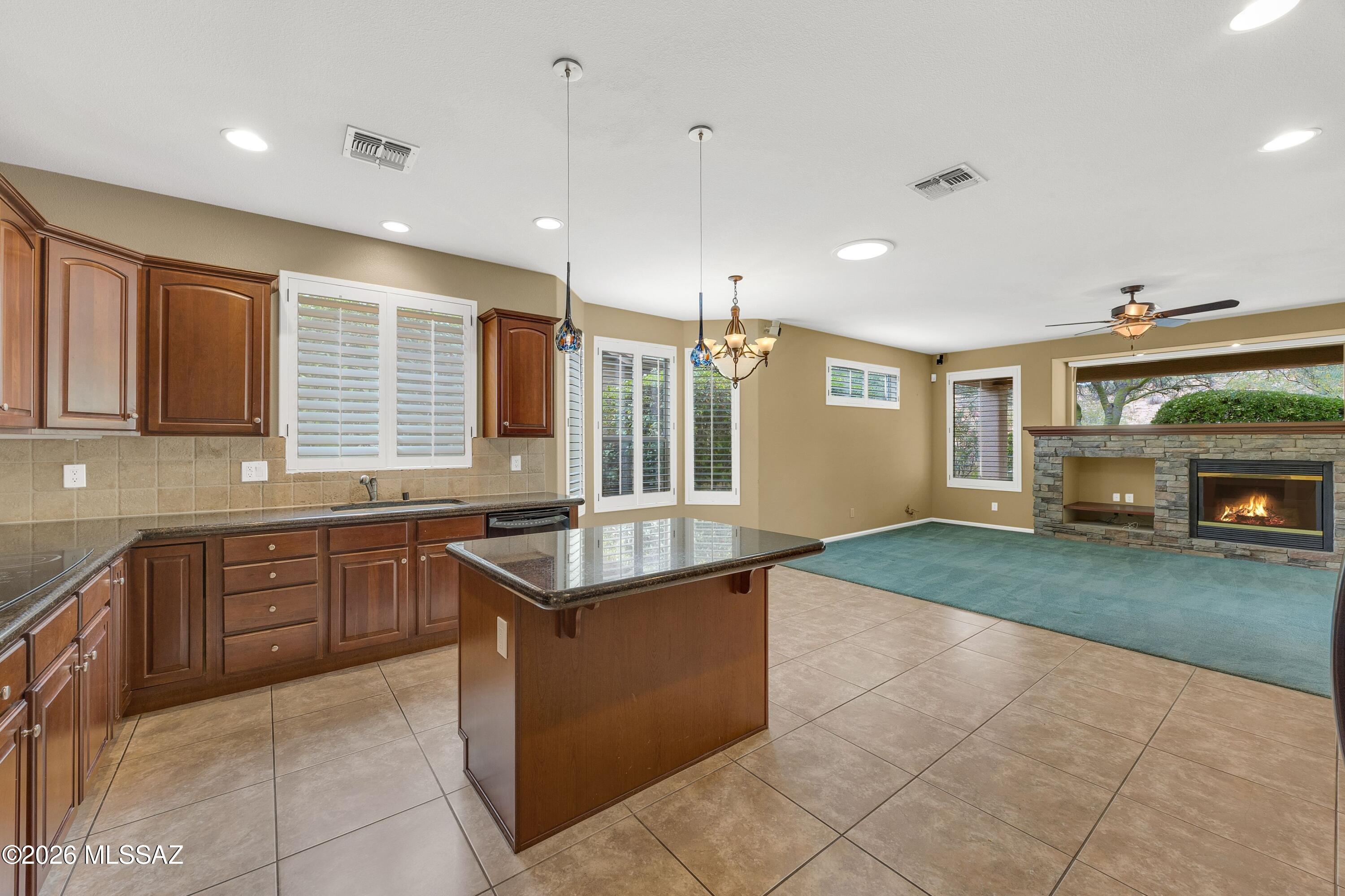62090 East Northwood Road Tucson, AZ 85739 - Photo 16 of 49 Island offers extra seating