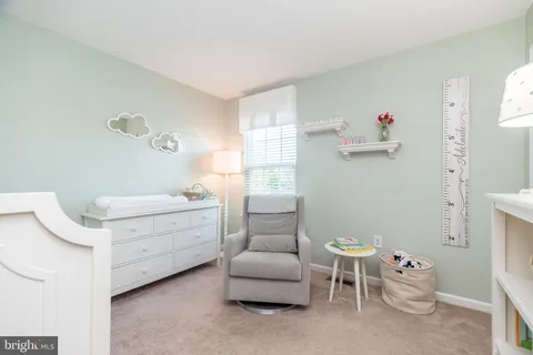 a room with a window and chair