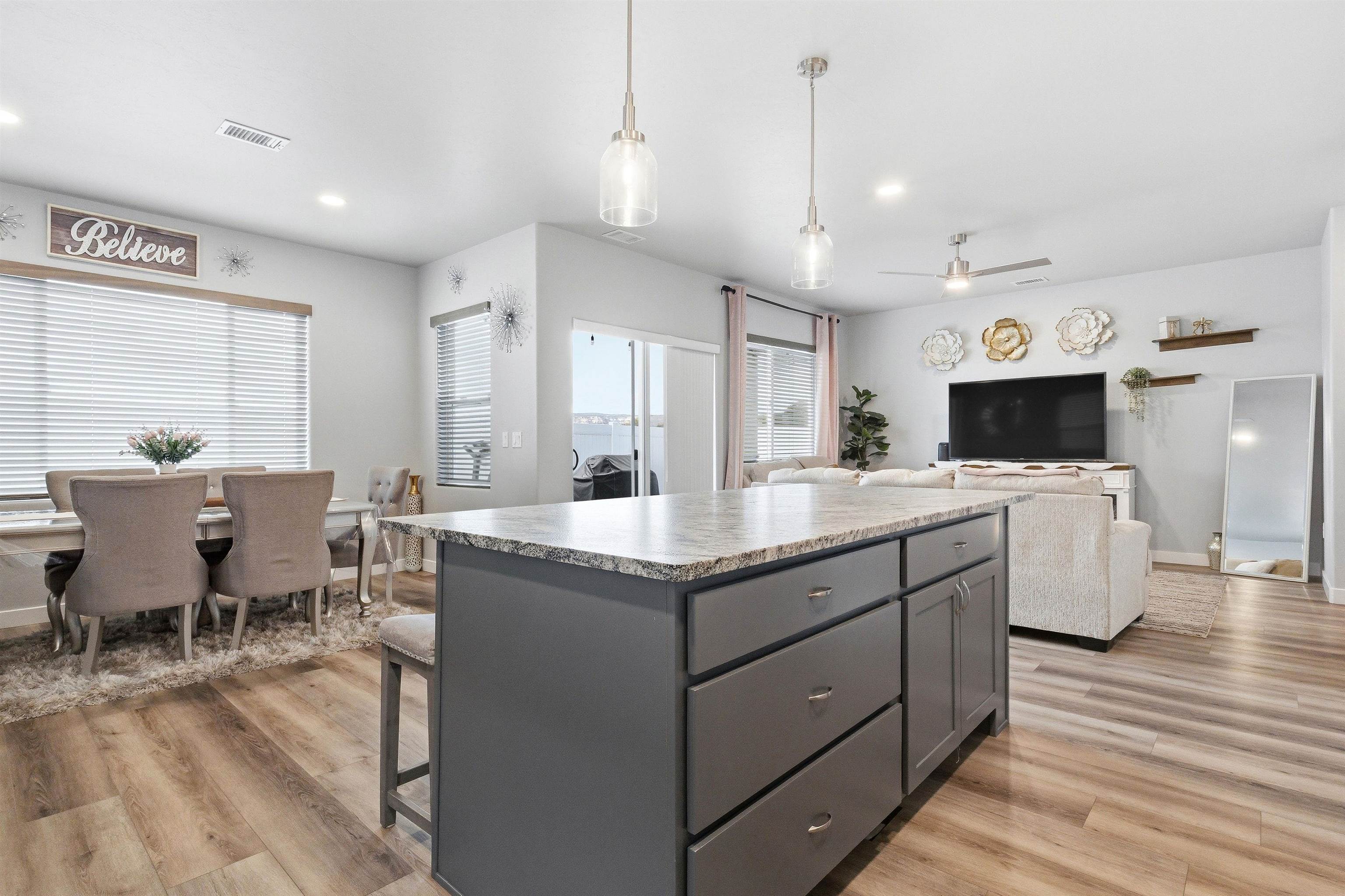 2459 Hamilton Road, Unit A Grand Junction, CO 81505 - Photo 11 of 27 a kitchen with stainless steel appliances kitchen island granite countertop a sink and a refrigerator