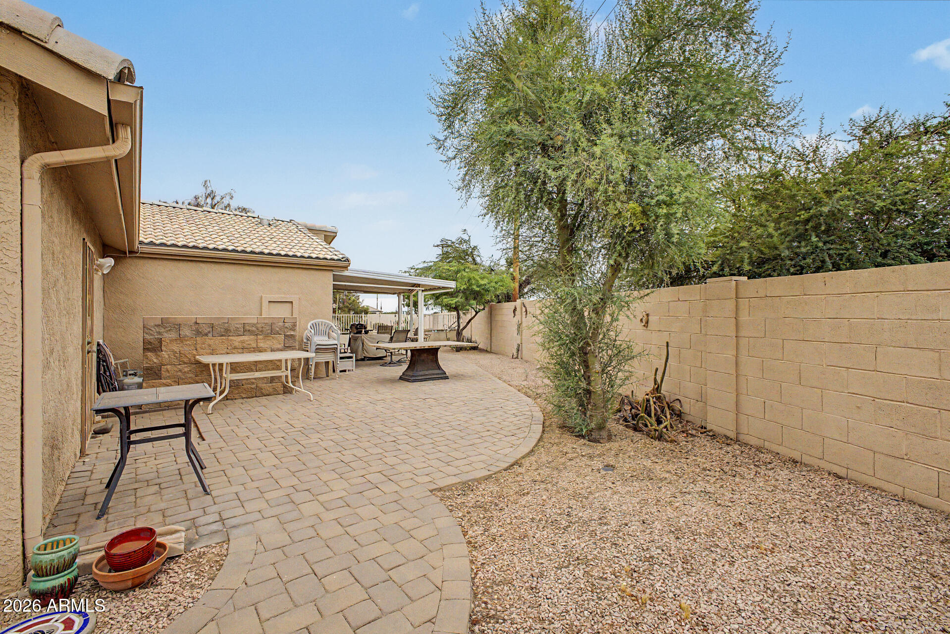 2101 South Meridian Road, Unit 45 Apache Junction, AZ 85120 - Photo 25 of 36 a view of a backyard with sitting area