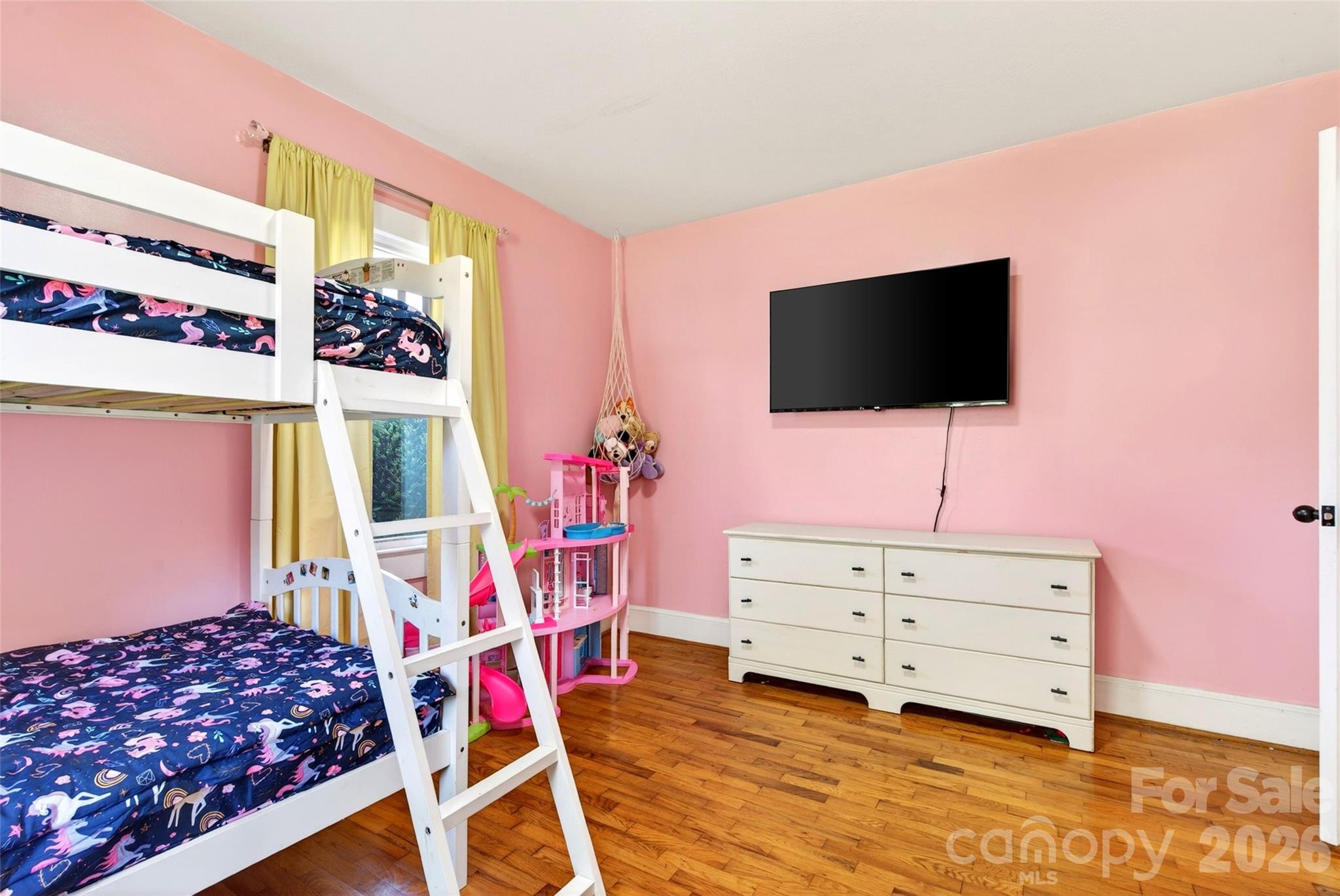 1511 White Oak Road Bakersville, NC 28705 - Photo 18 of 33 a bedroom with furniture and a flat screen tv