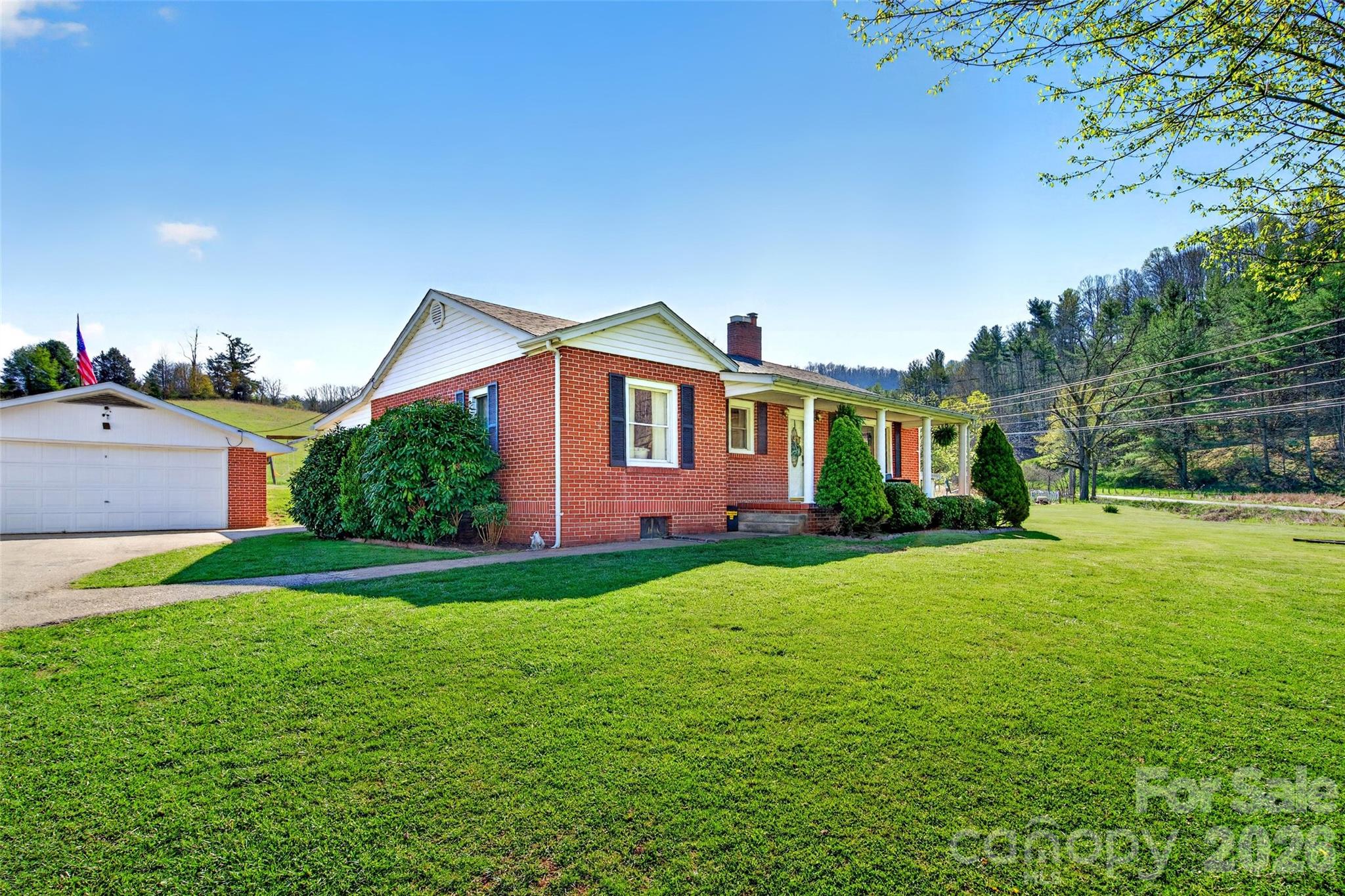 1511 White Oak Road Bakersville, NC 28705 - Photo 30 of 33 a front view of a house with garden
