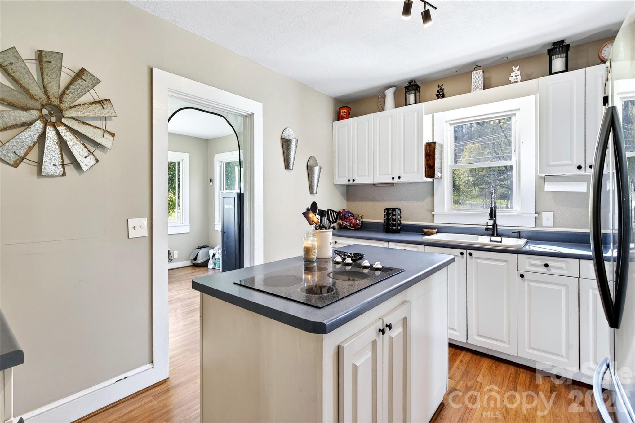 1511 White Oak Road Bakersville, NC 28705 - Photo 6 of 33 a kitchen with stainless steel appliances granite countertop a stove a sink and a refrigerator
