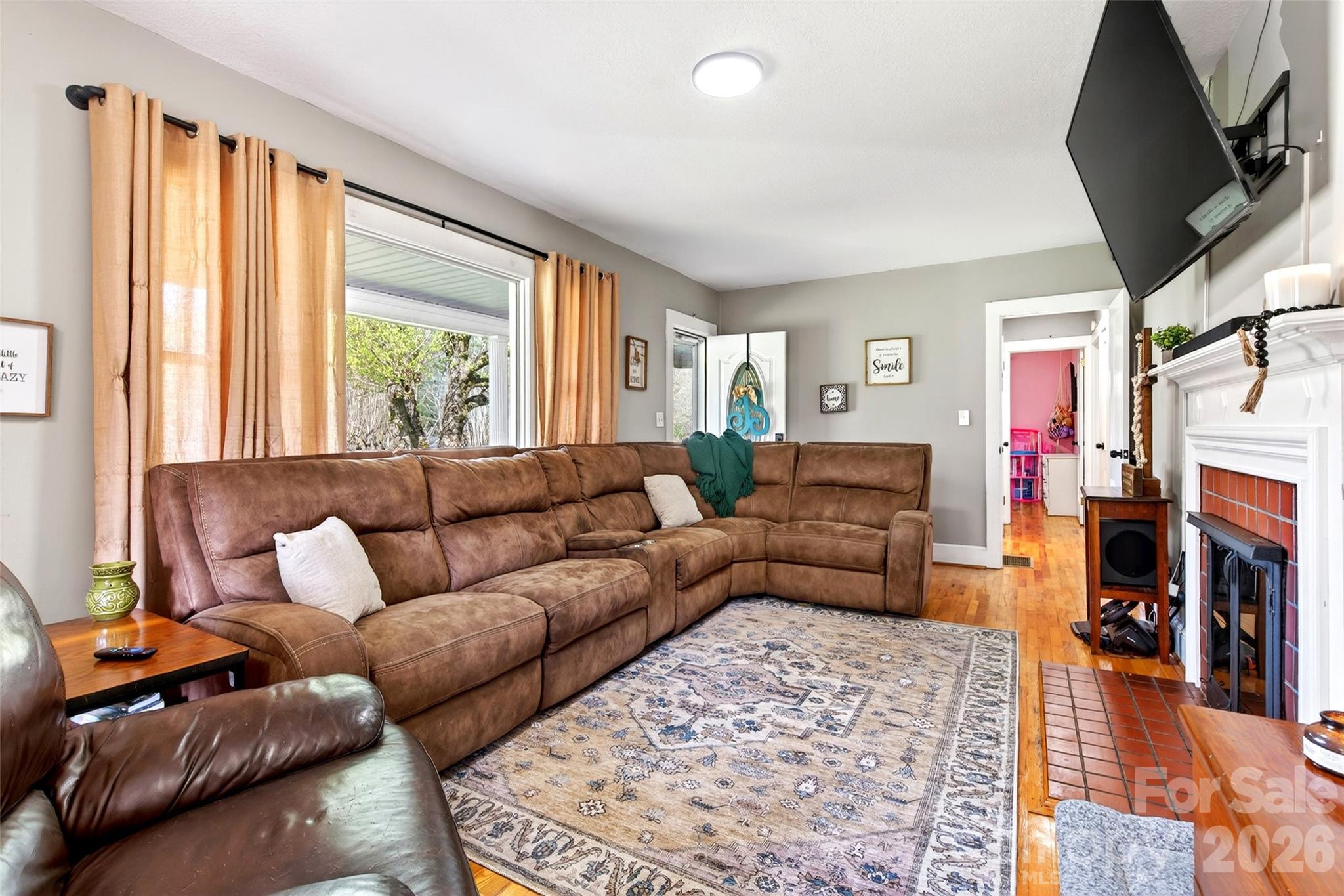 1511 White Oak Road Bakersville, NC 28705 - Photo 10 of 33 a living room with furniture and a flat screen tv