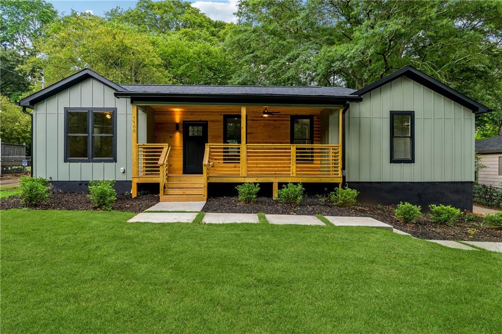 1100 Forrest Boulevard Decatur, GA 30030 - Photo 1 of 1 a front view of a house with a yard and outdoor seating