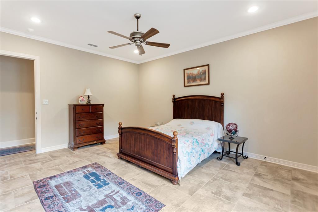 8350 FM 346 Flint, TX 75762 - Photo 12 of 39 a bedroom with a bed and a chandelier